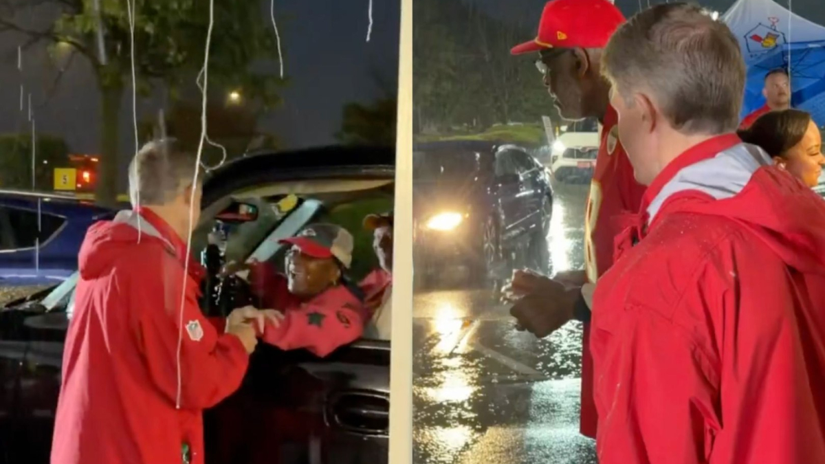 Billionaire Chiefs owner Clark Hunt stands in pouring rain to hand $5 flags to fans