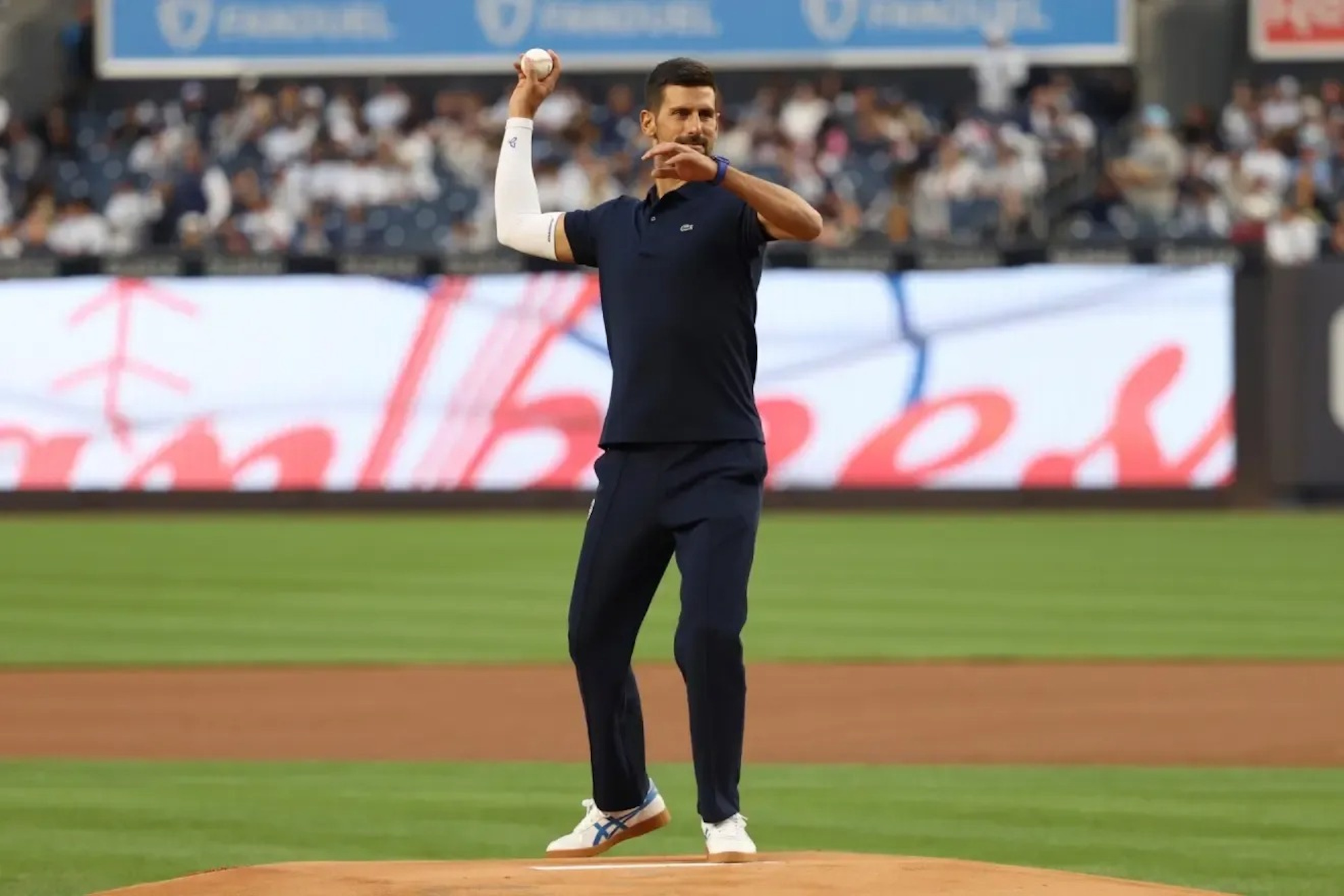 Novak Djokovic throws out the first pitch at the New York Yankees game.
