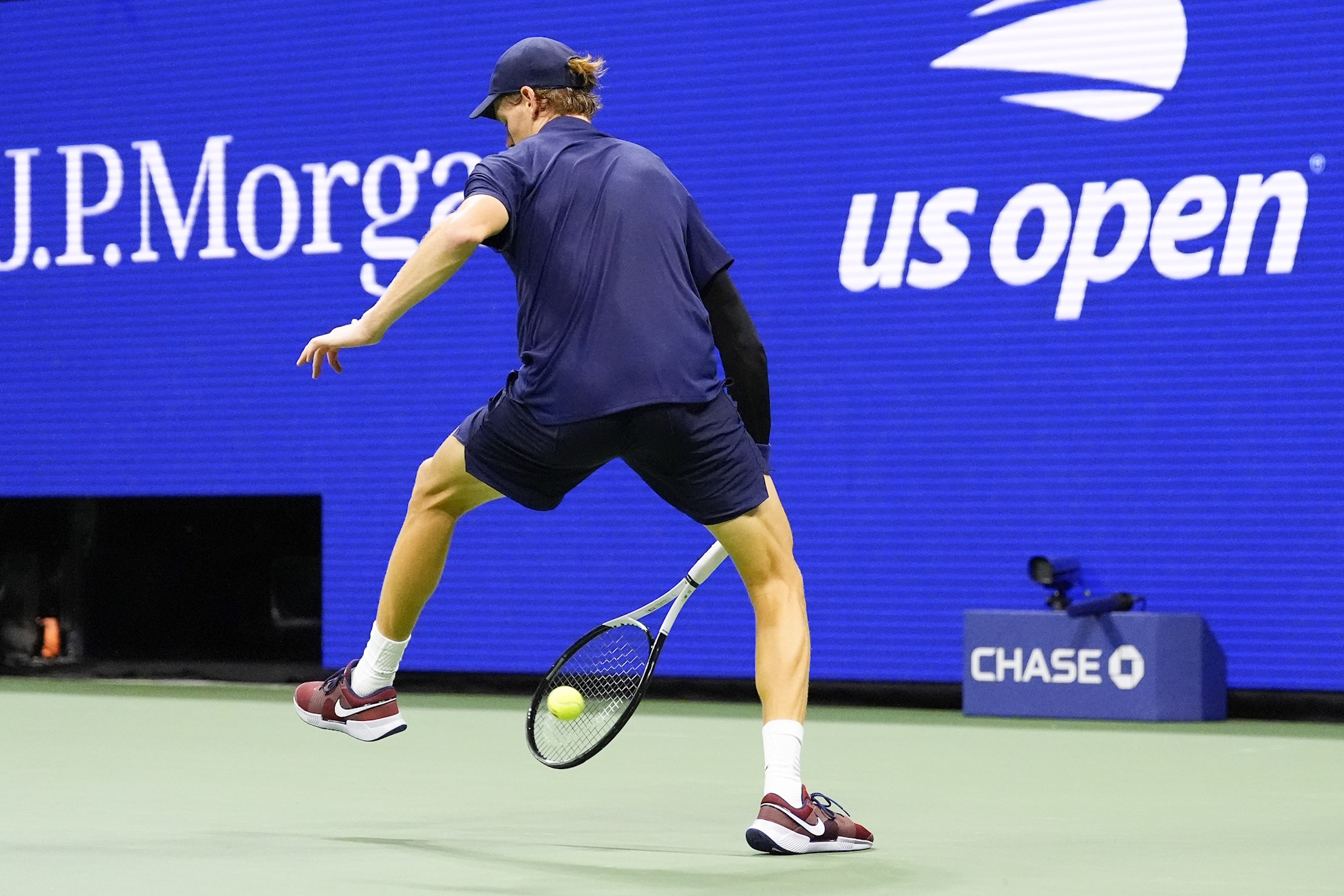 Jannik Sinner, of Italy, returns a shot to Felix Auger-Aliassime, of Canada.