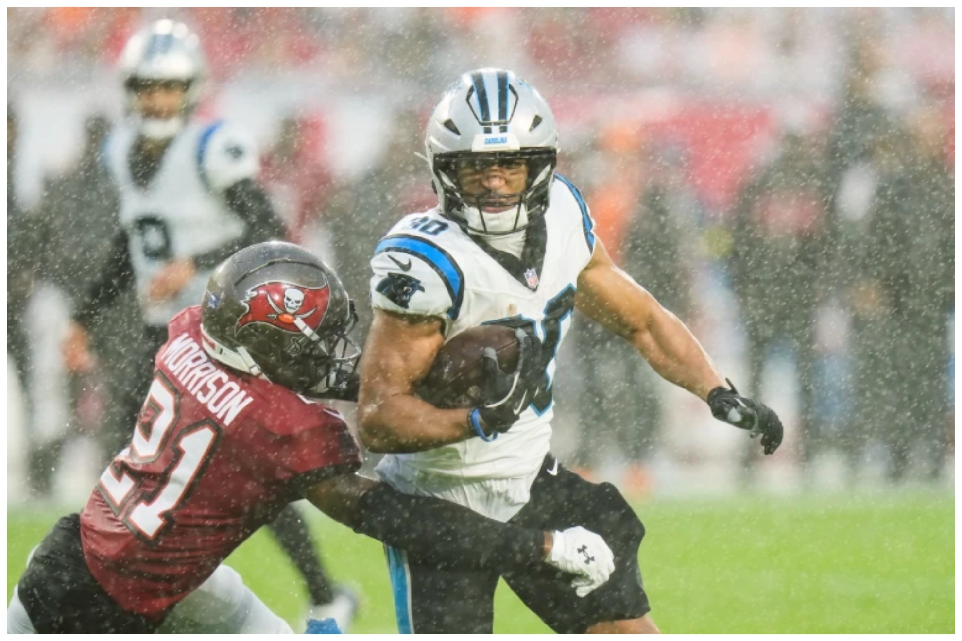 Panthers running back Chuba Hubbard (30) runs around the tackle attempt from Tampa Bay Buccaneers cornerback Benjamin Morrison