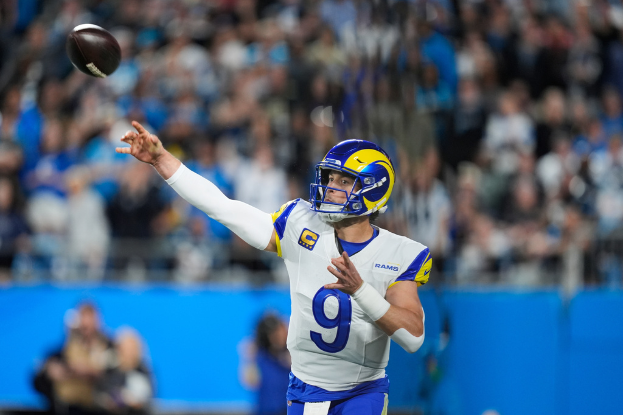 Los Angeles Rams quarterback Matthew Stafford (9) throws a pass during the first half of an NFL wild-card playoff football game