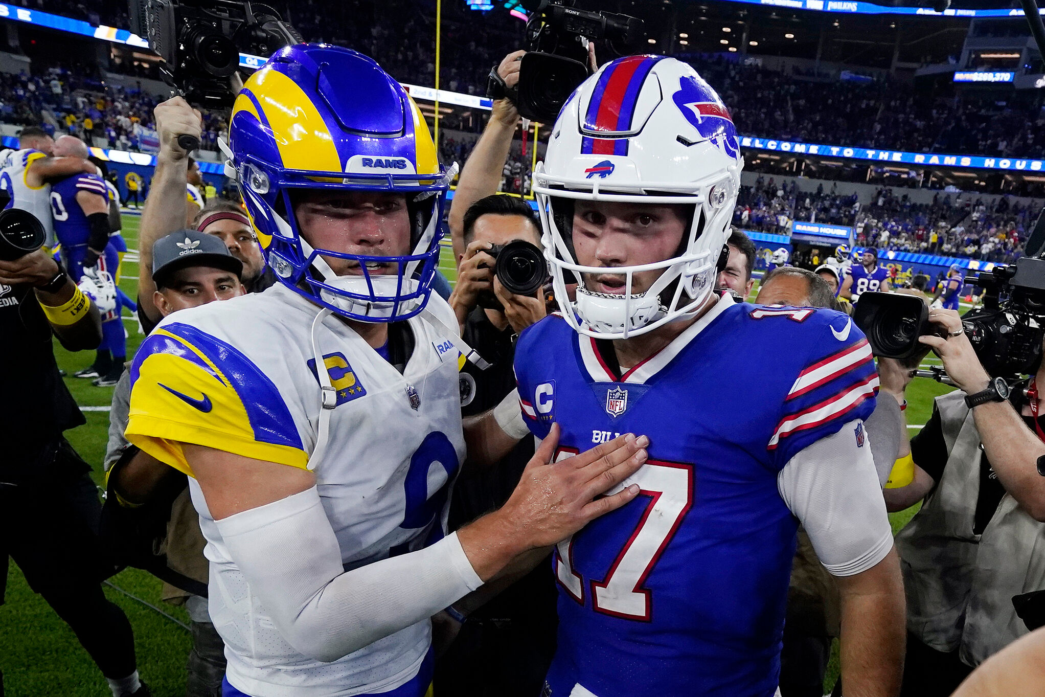 Los Angeles Rams quarterback Matthew Stafford (9) and Buffalo Bills quarterback Josh Allen (17) meet at mid-field after an NFL football game