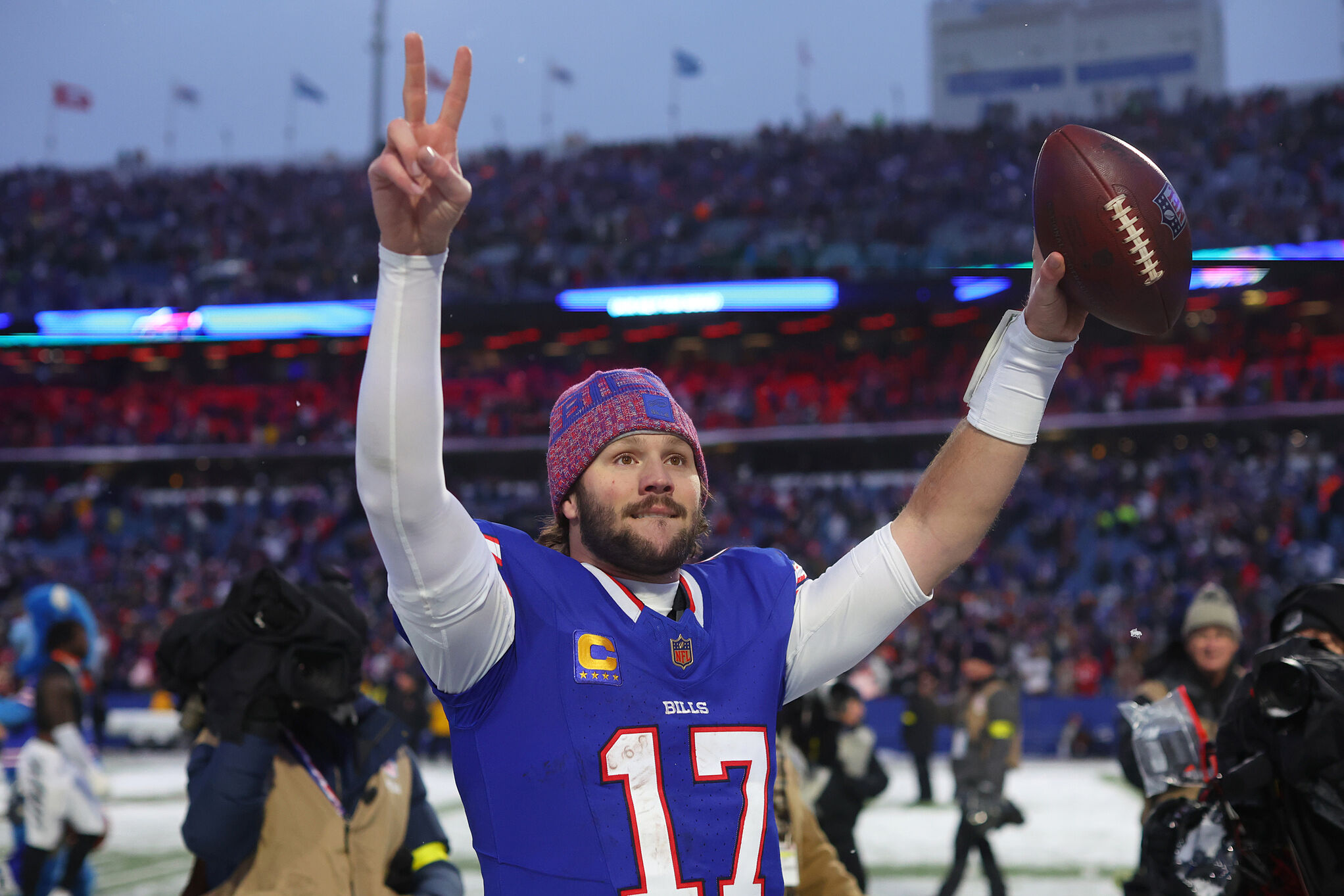 Buffalo Bills quarterback Josh Allen gestures as he walks from the field after an NFL football game against the Cincinnati Bengals