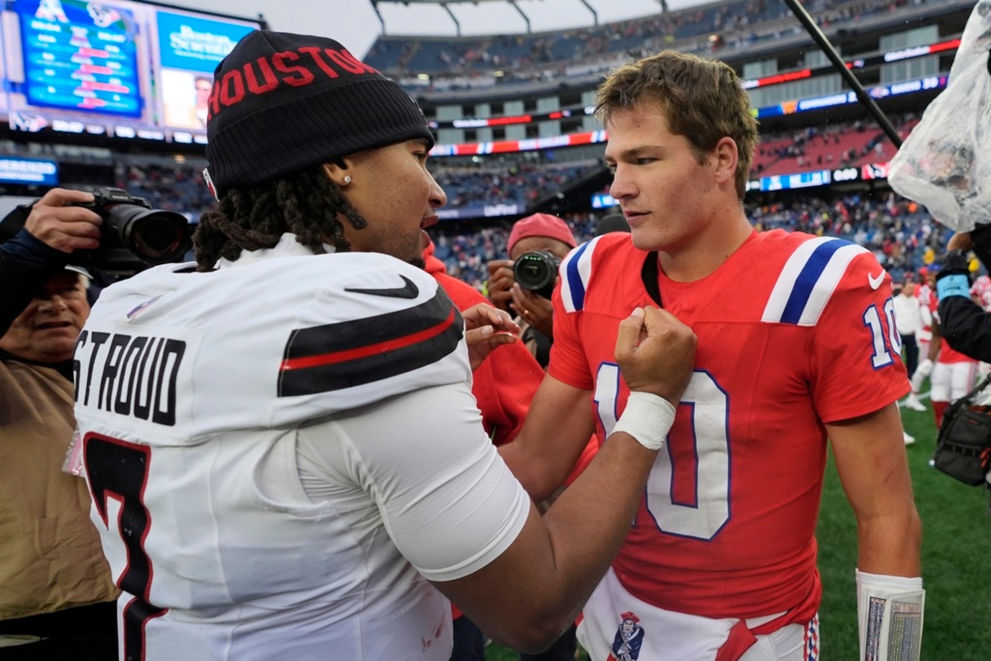 Drake Maye (10) and Houston Texans quarterback C.J. Stroud.