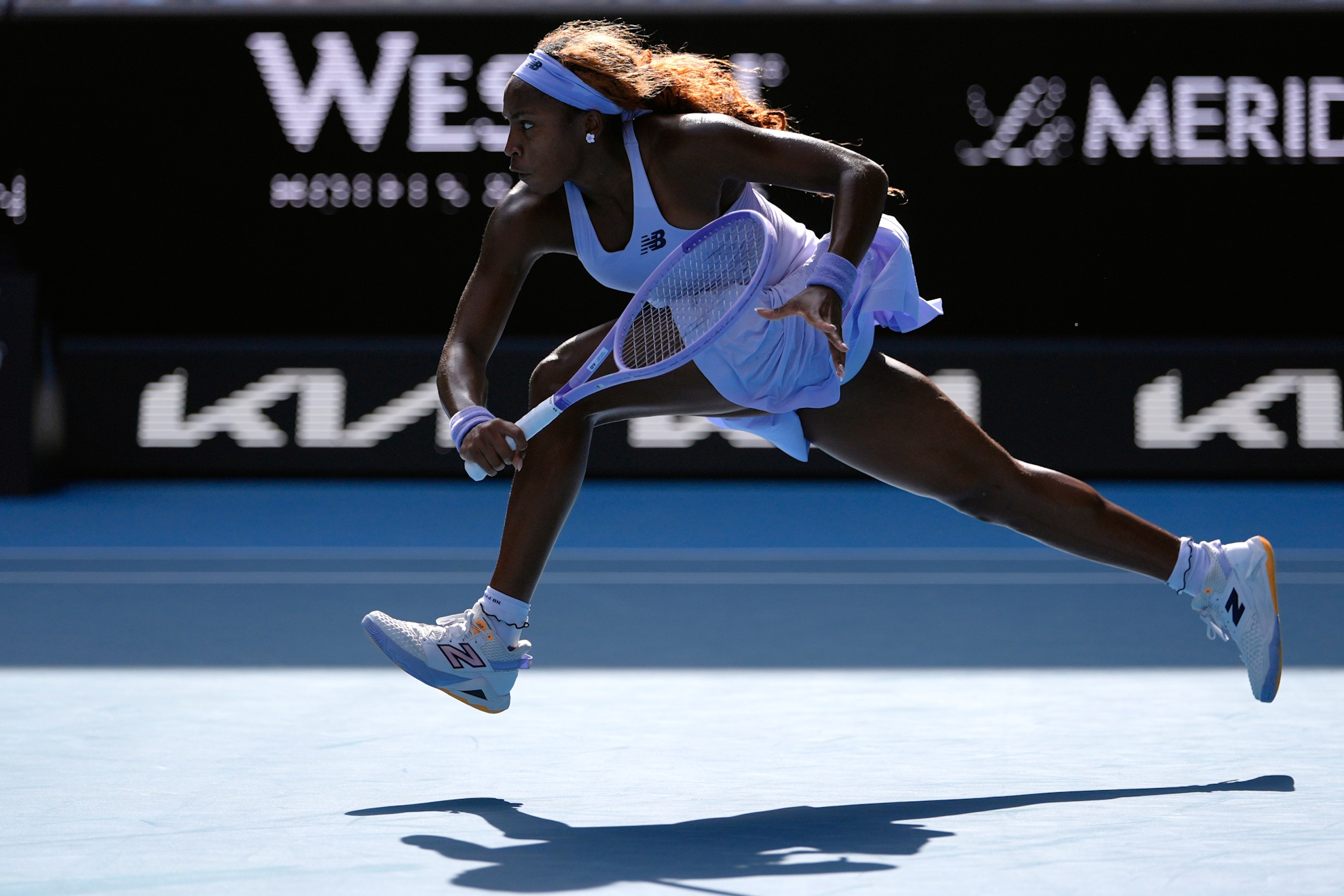 Coco Gauff plays a backhand return to Karolina Muchova.