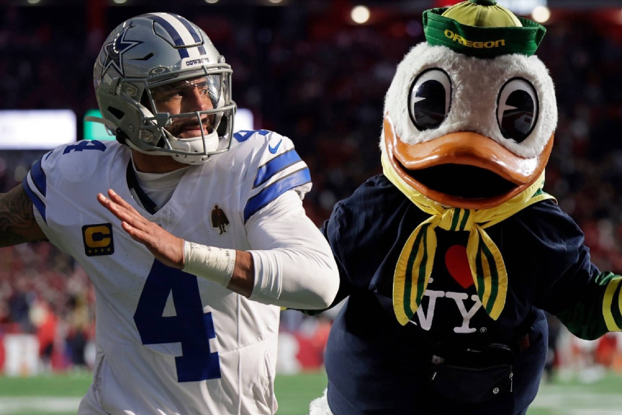 Dak Prescott & The mascot of the Oregon Ducks