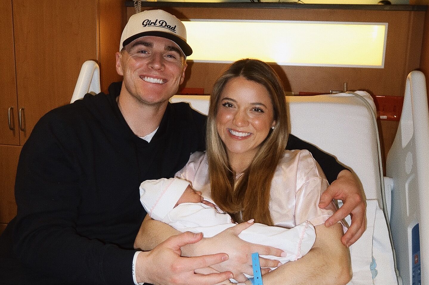 Bo Nix and his wife, Izzy, pose with their newborn daughter, Riley Belle Nix