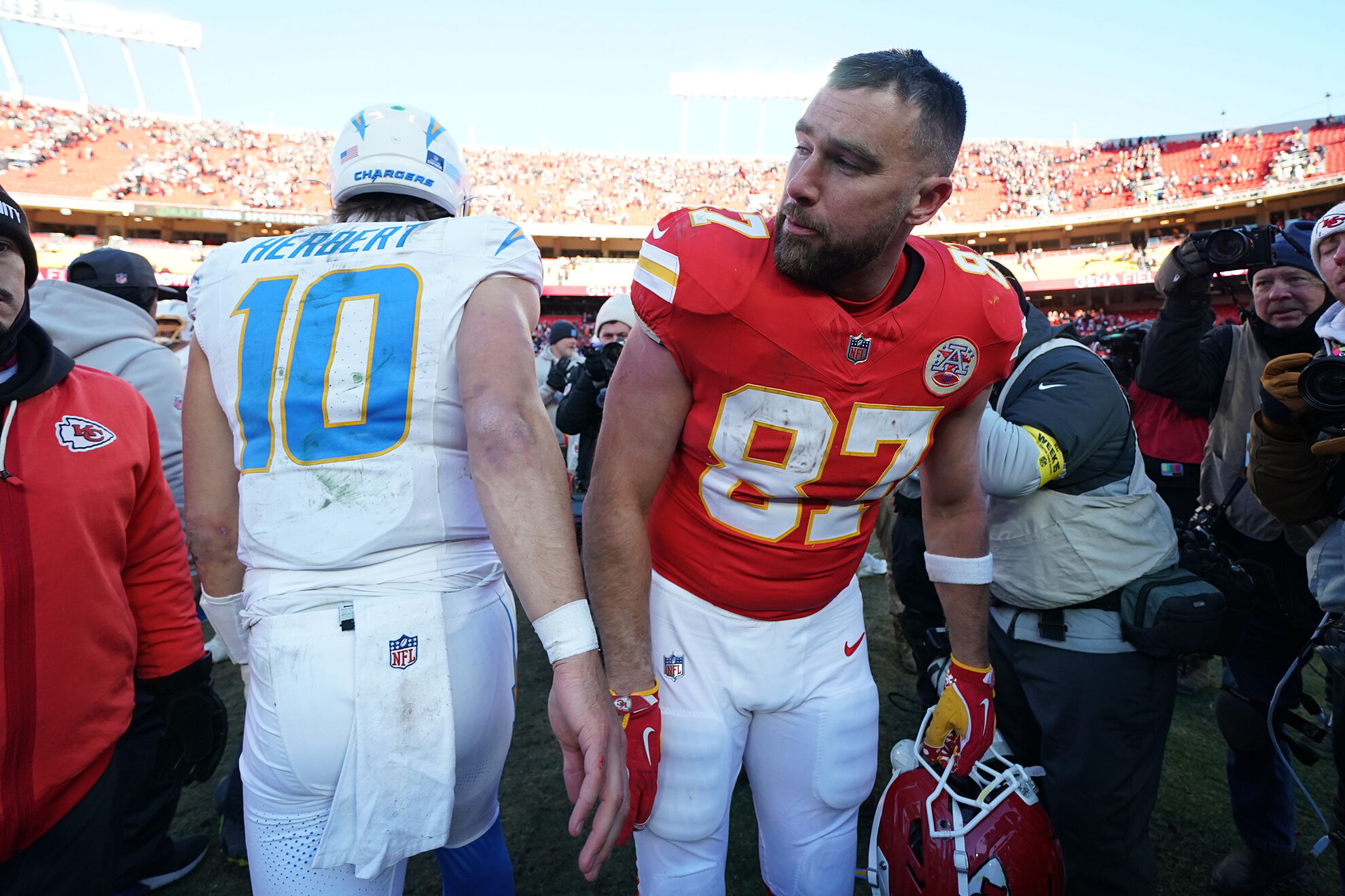 Kansas City Chiefs Travis Kelce walks past Los Angeles Chargers quarterback Justin Herbert