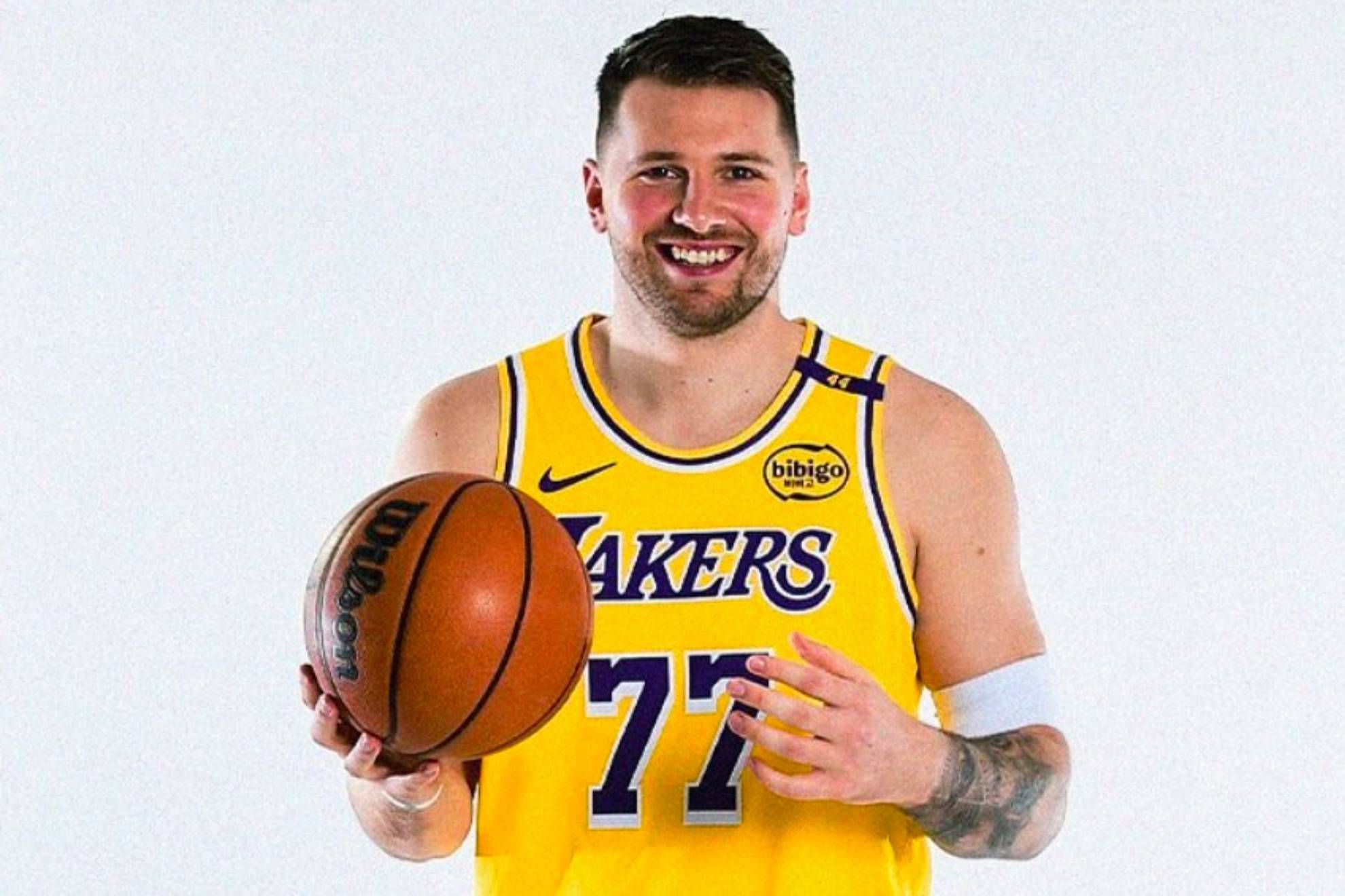 Luka Doncic posing with the Lakers uniform