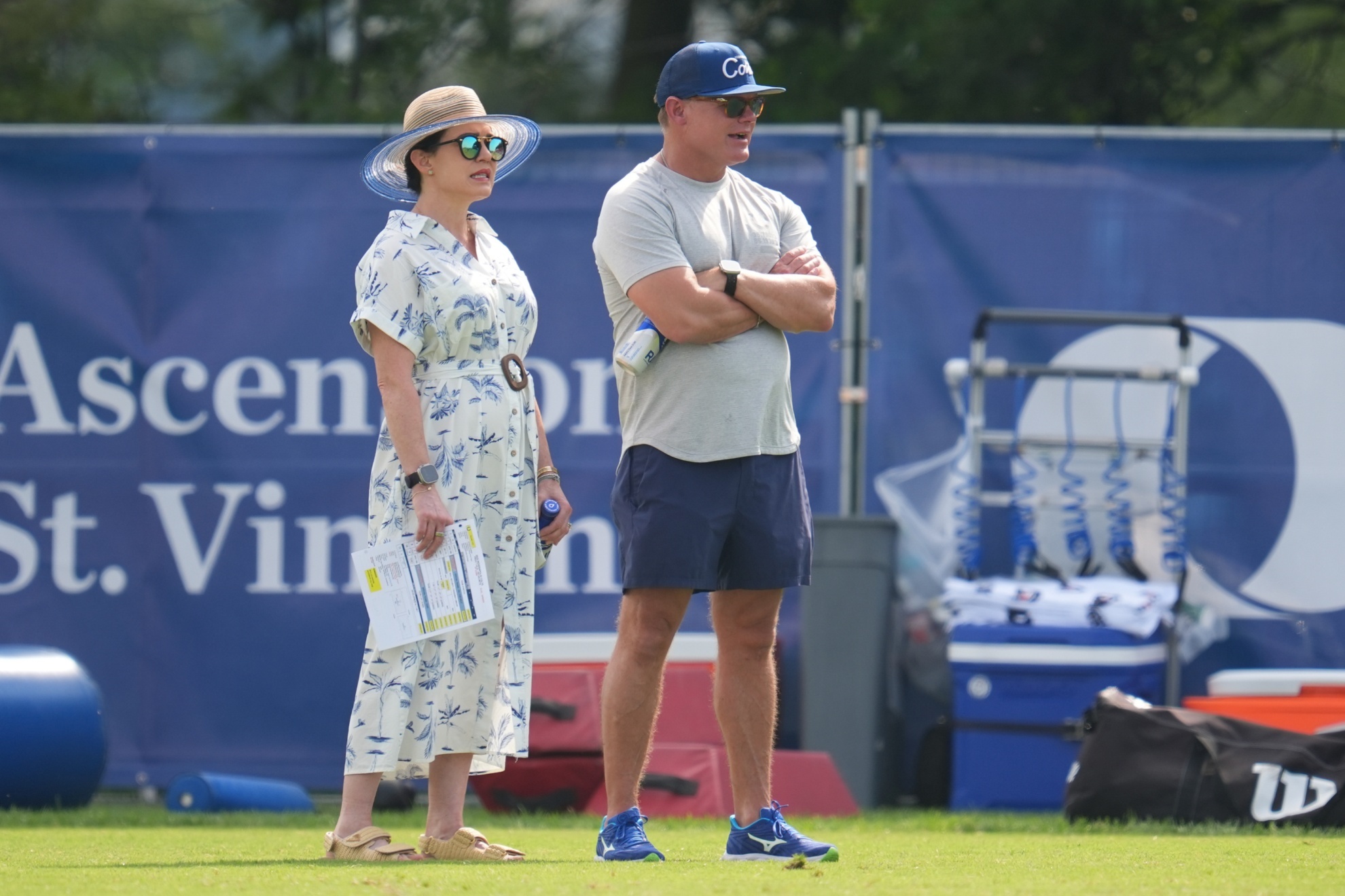 Carlie Irsay-Gordon (L) talks with GM Chris Ballard during Colts training camp.