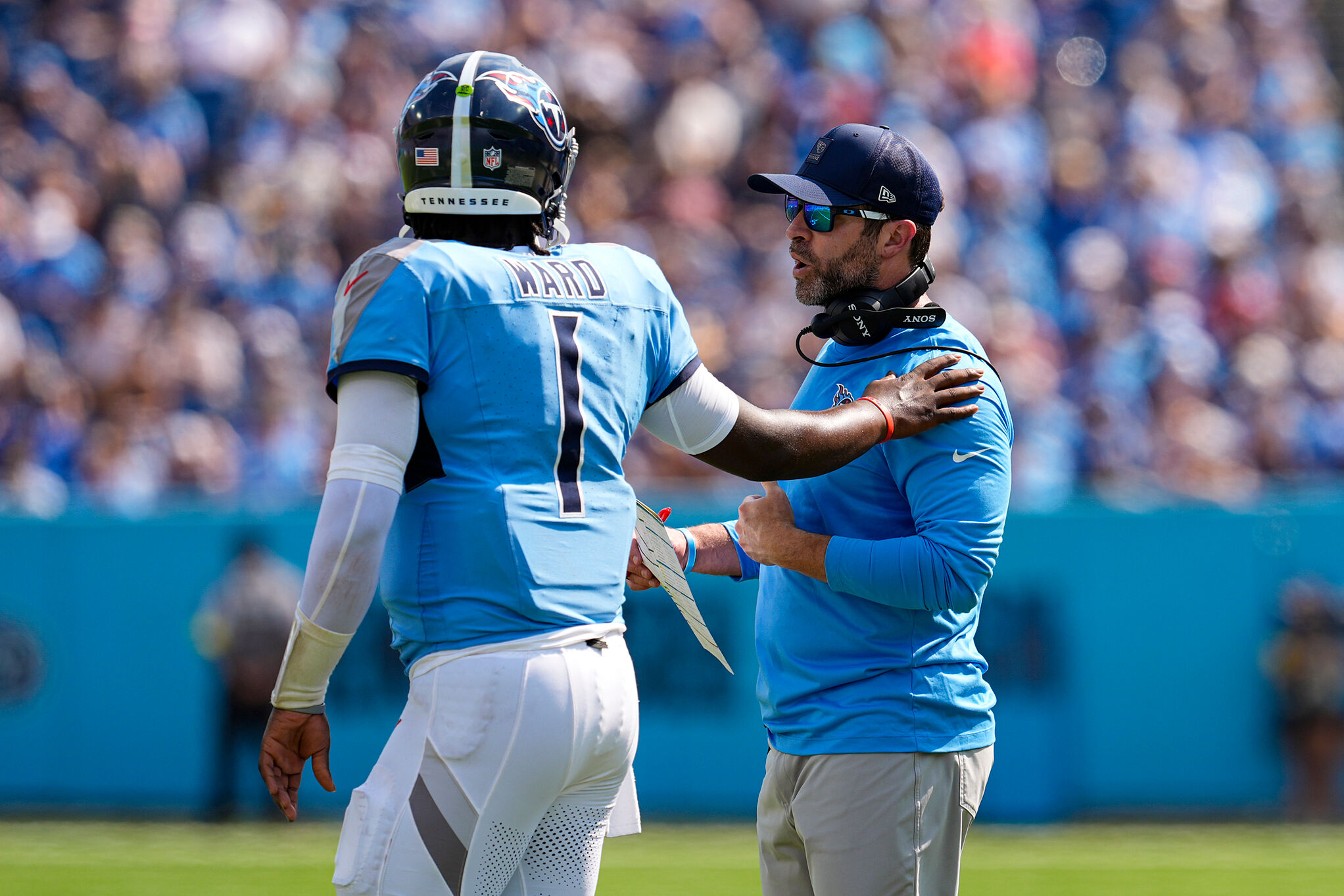 Tennessee Titans head coach Brian Callahan talks with quarterback Cam Ward (1) during the NFL football game against the Indianapolis Colts