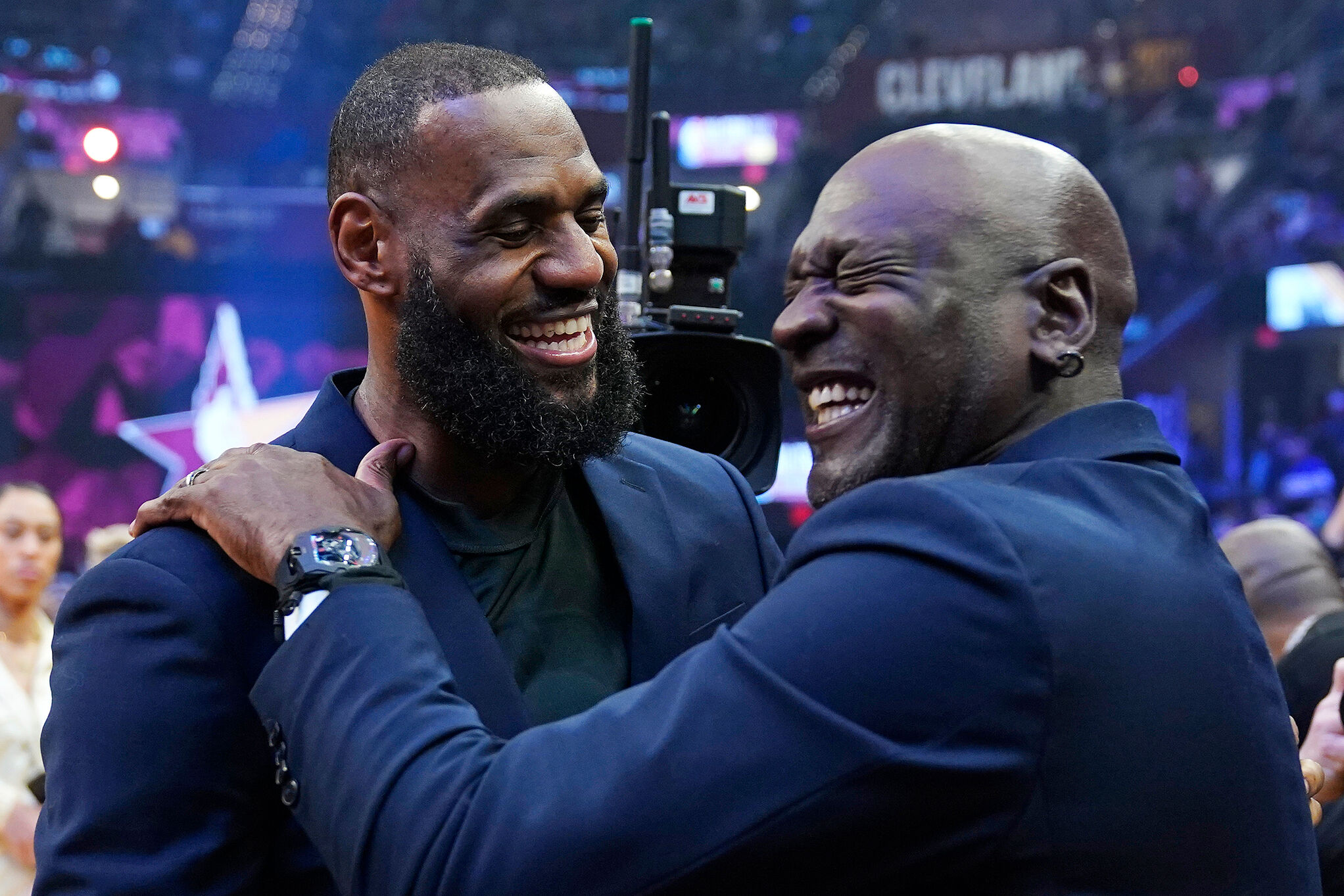 Los Angeles Lakers' LeBron James, left, shares a laugh with NBA legend MIchael Jordan during the NBA All-Star game in Cleveland
