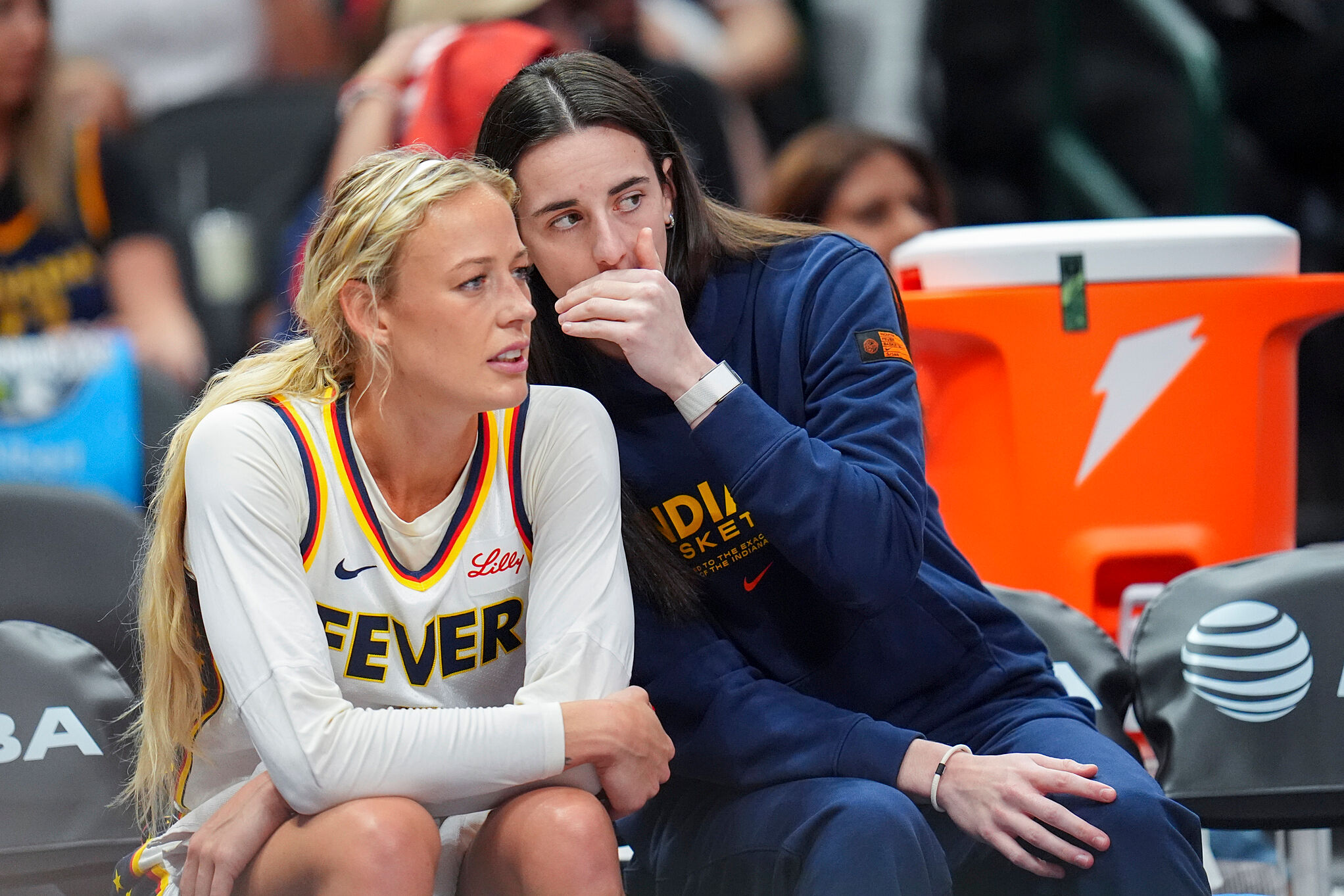 Indiana Fever guard Caitlin Clark, right, talks with guard Sophie Cunningham a WNBA basketball game against the Dallas Wings
