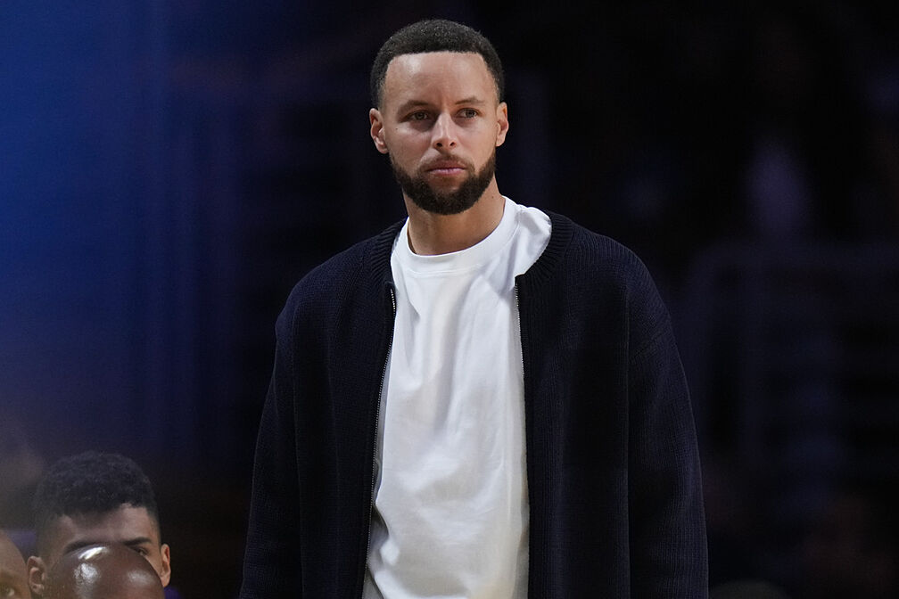 Stephen Curry watches on during the Golden State Warriors vs. Los Angeles Lakers game.