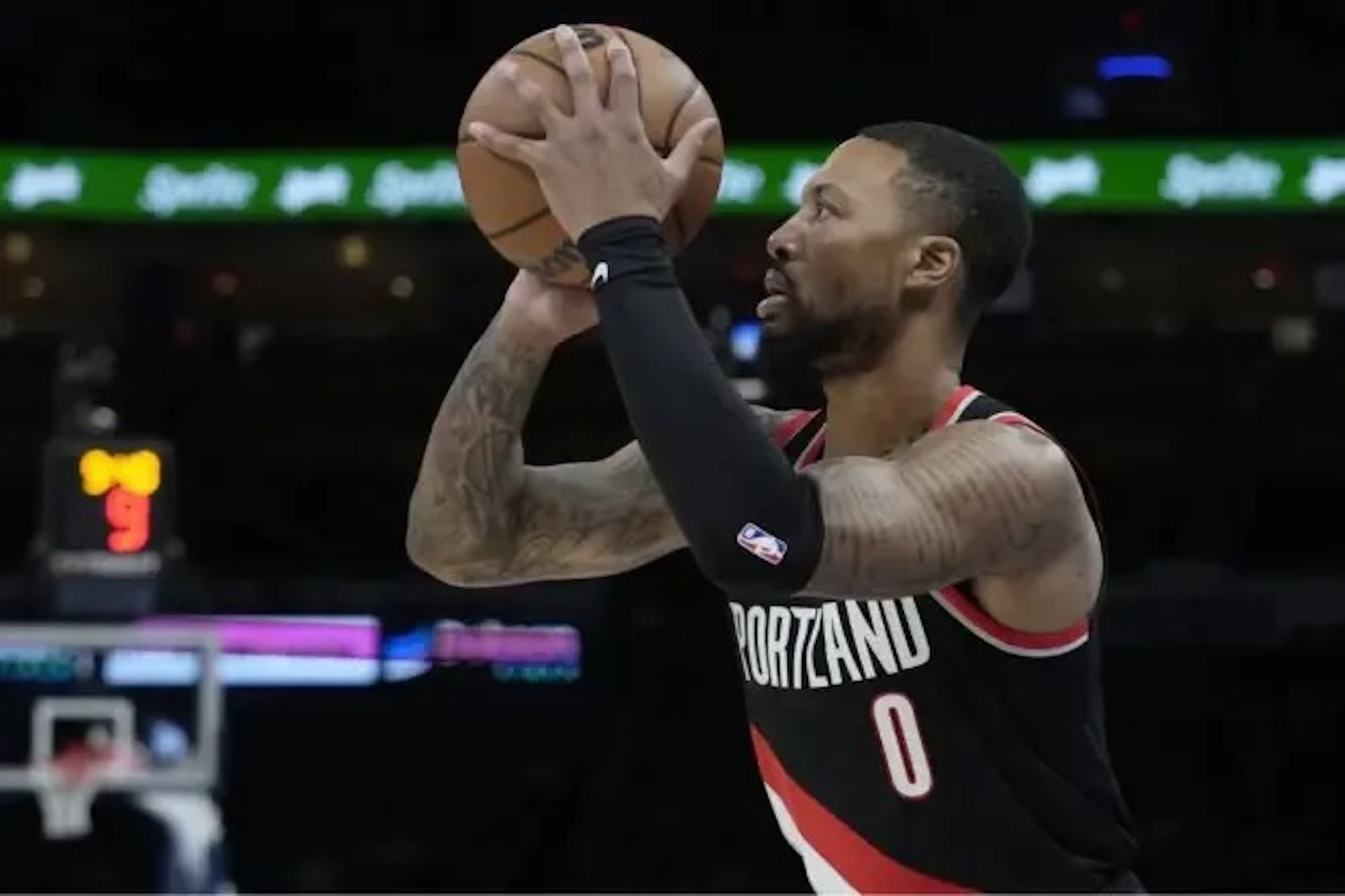 Damian Lillard, star player for the Blazers, about to shoot a three-pointer.