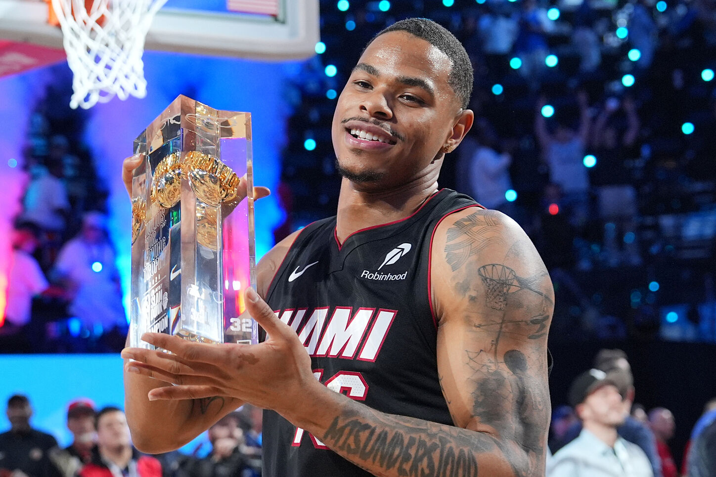 Miami Heat player Keshad Johnson poses with his Slam Dunk Contest trophy.