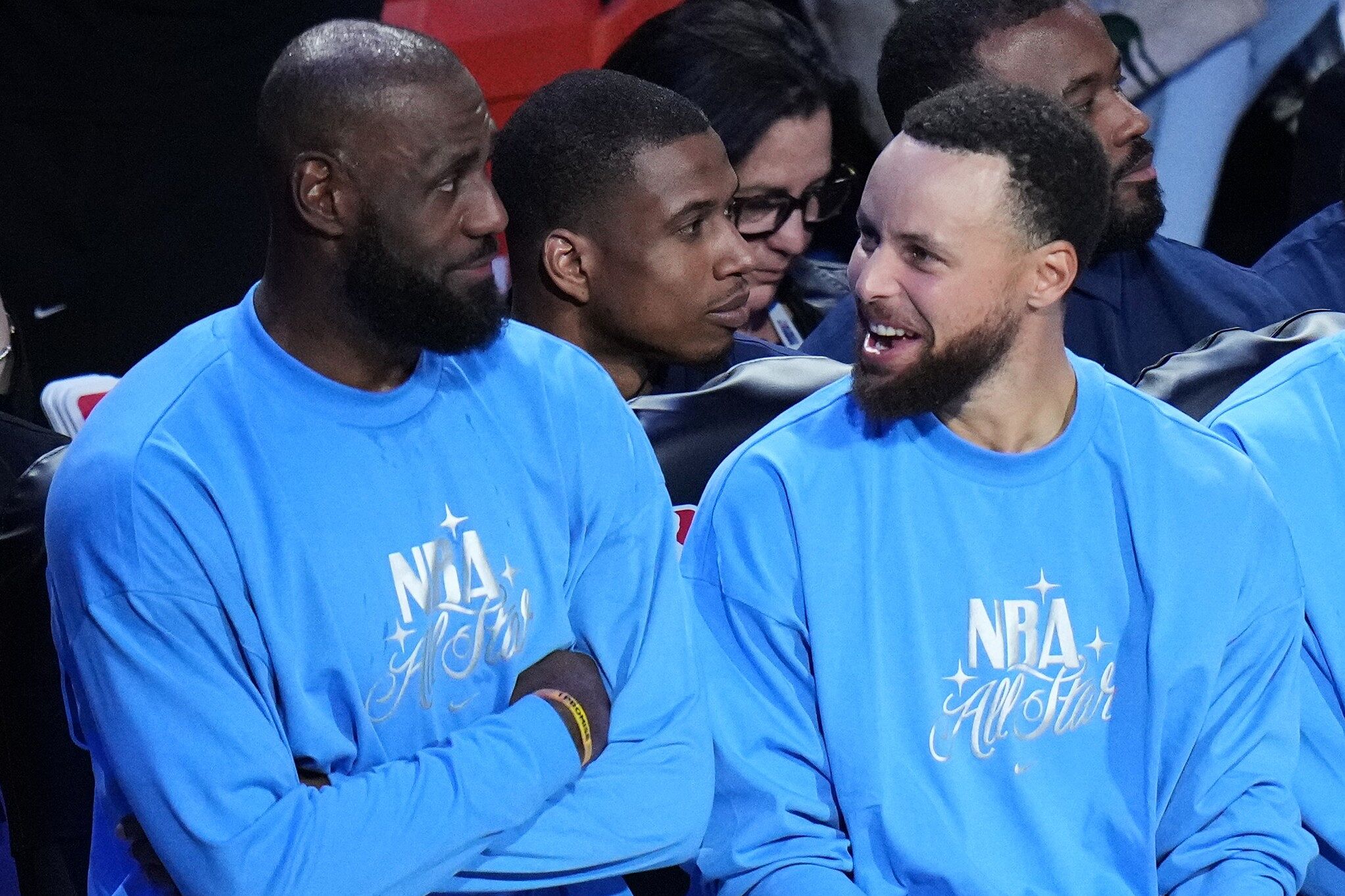 USA Stripes guard Stephen Curry talks to forward LeBron James during the NBA All-Star basketball game against USA Stars