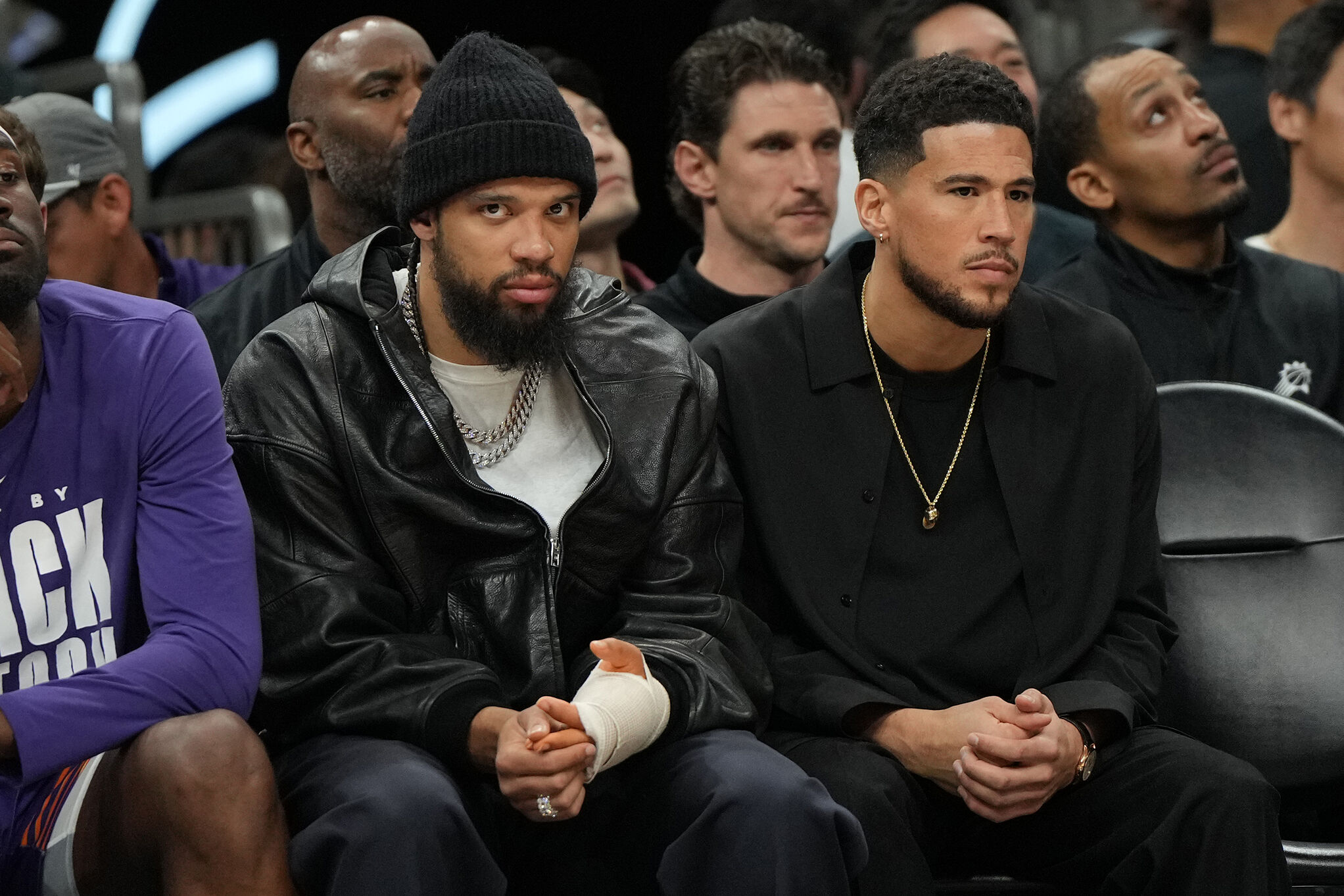 Phoenix Suns forward Dillon Brooks (3) and guard Devin Booker (1) sit on the bench against the Los Angeles Lakers during an NBA game