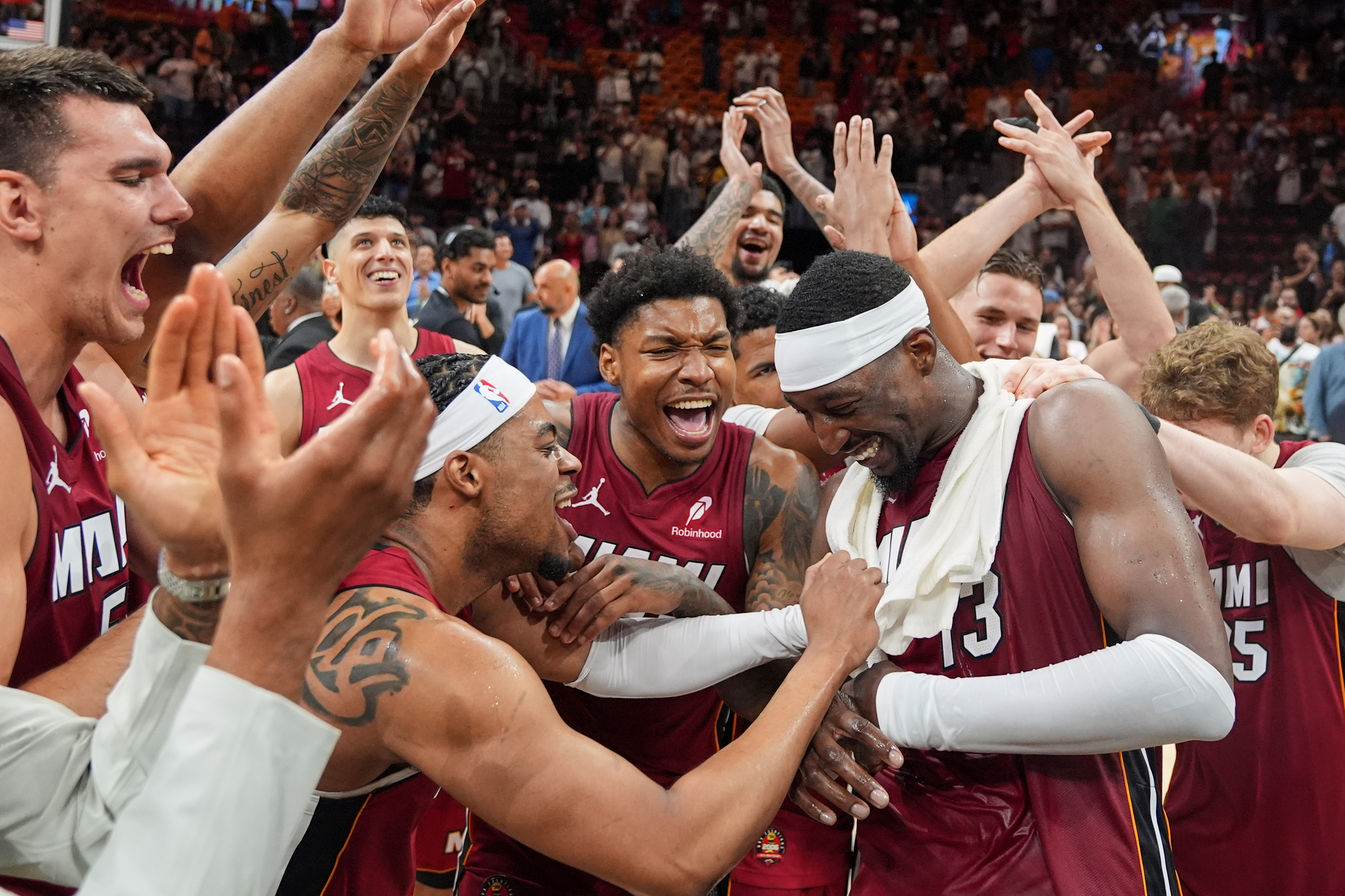Miami Heat teammates celebrate center Bam Adebayo scoring 83 points against the Washington Wizards