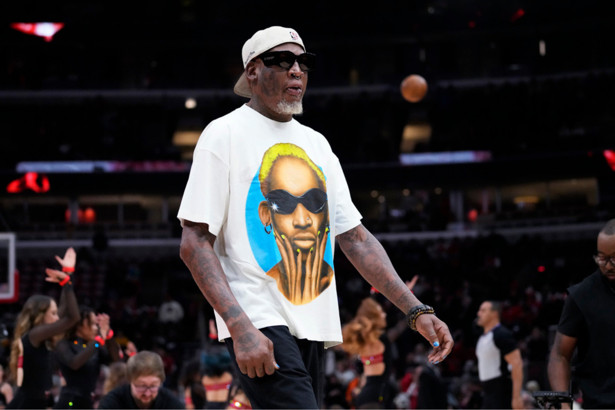 ormer Chicago Bulls player Dennis Rodman walks on the court before an NBA basketball game