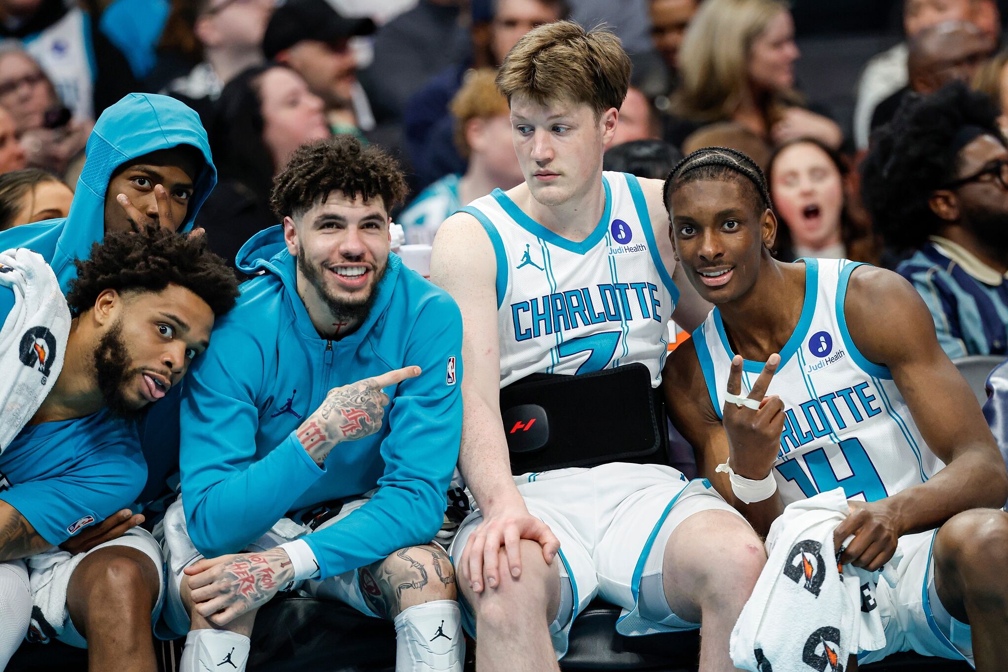 From left to right, Charlotte Hornets forward Miles Bridges, forward Brandon Miller, guard LaMelo Ball, guard Kon Knueppel and forward Moussa Diabate sit on the bench