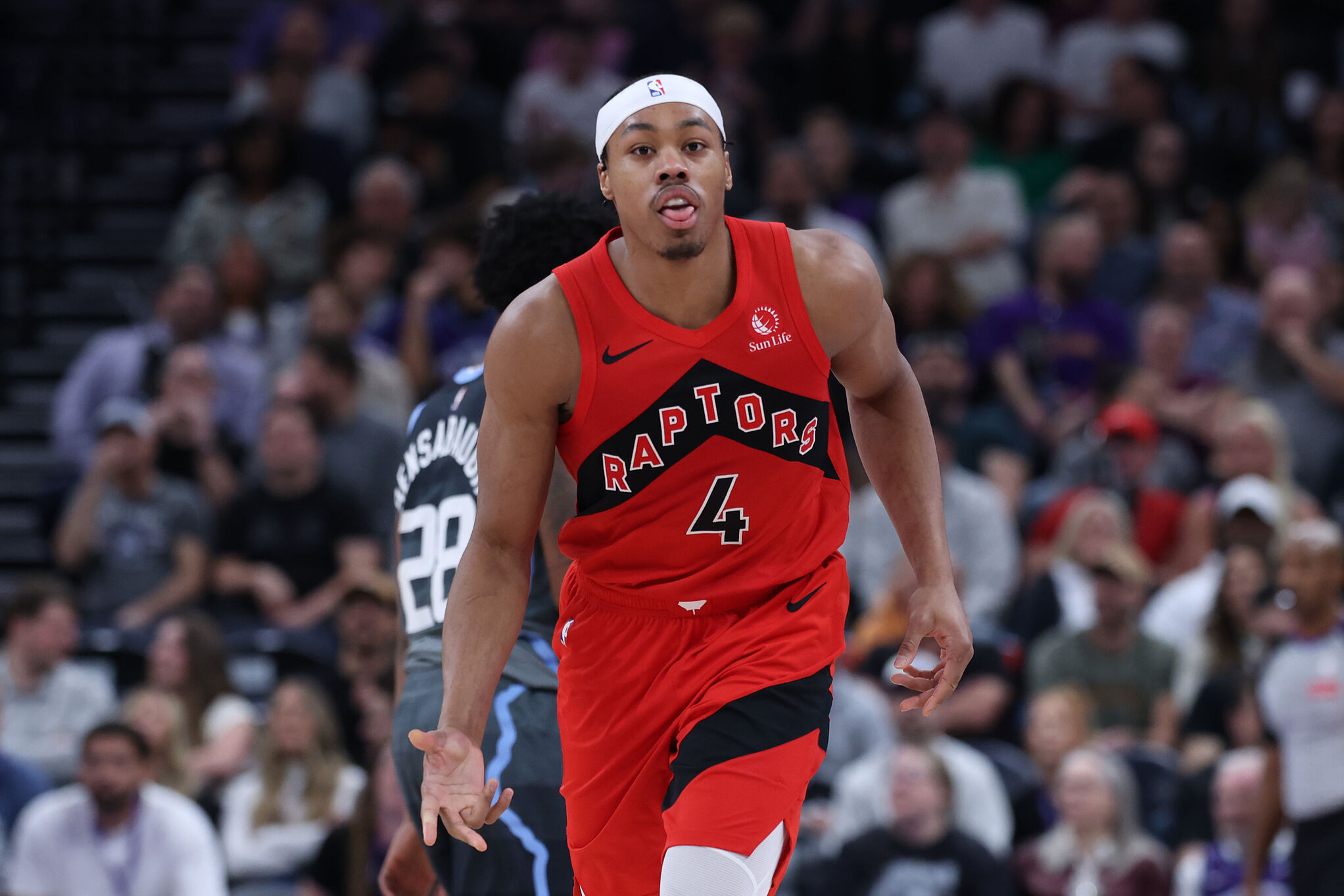 Toronto Raptors forward Scottie Barnes reacts after making a basket at the buzzer to end the first half of an NBA basketball game against the Utah Jazz