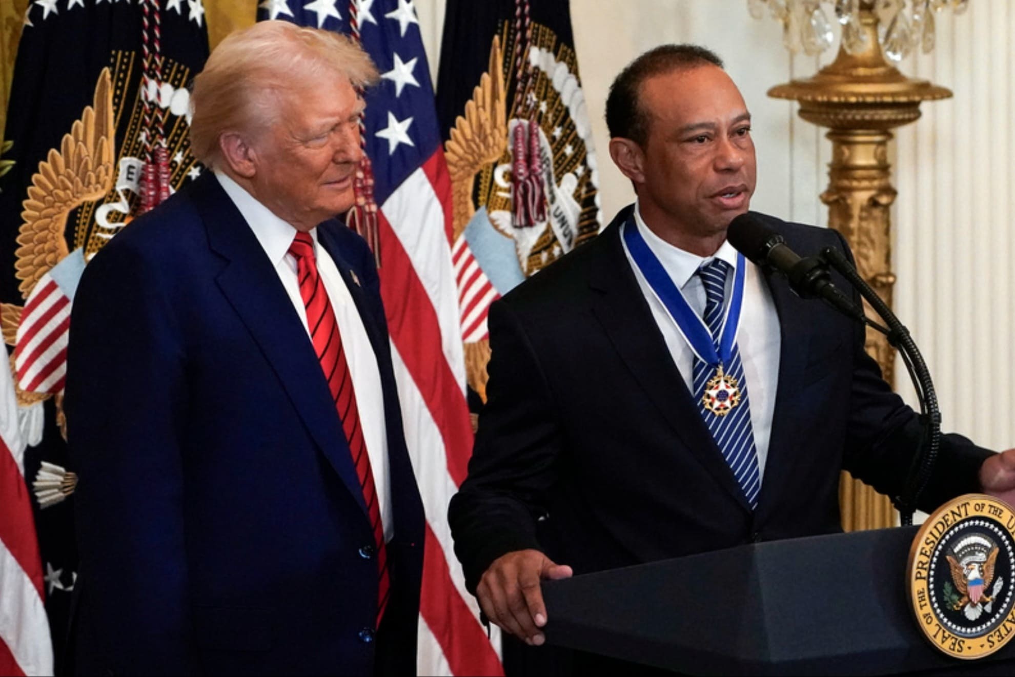Donald Trump and Tiger Woods Lapresse