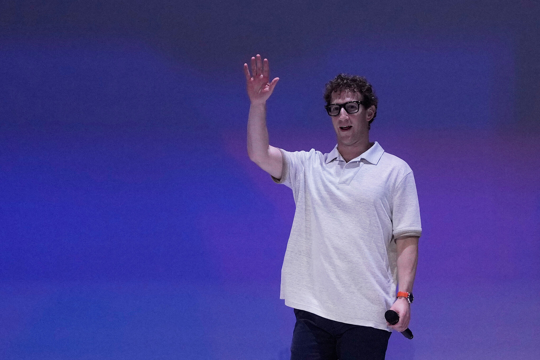 Meta Founder and CEO Mark Zuckerberg waves before speaking at LlamaCon 2025, an AI developer conference
