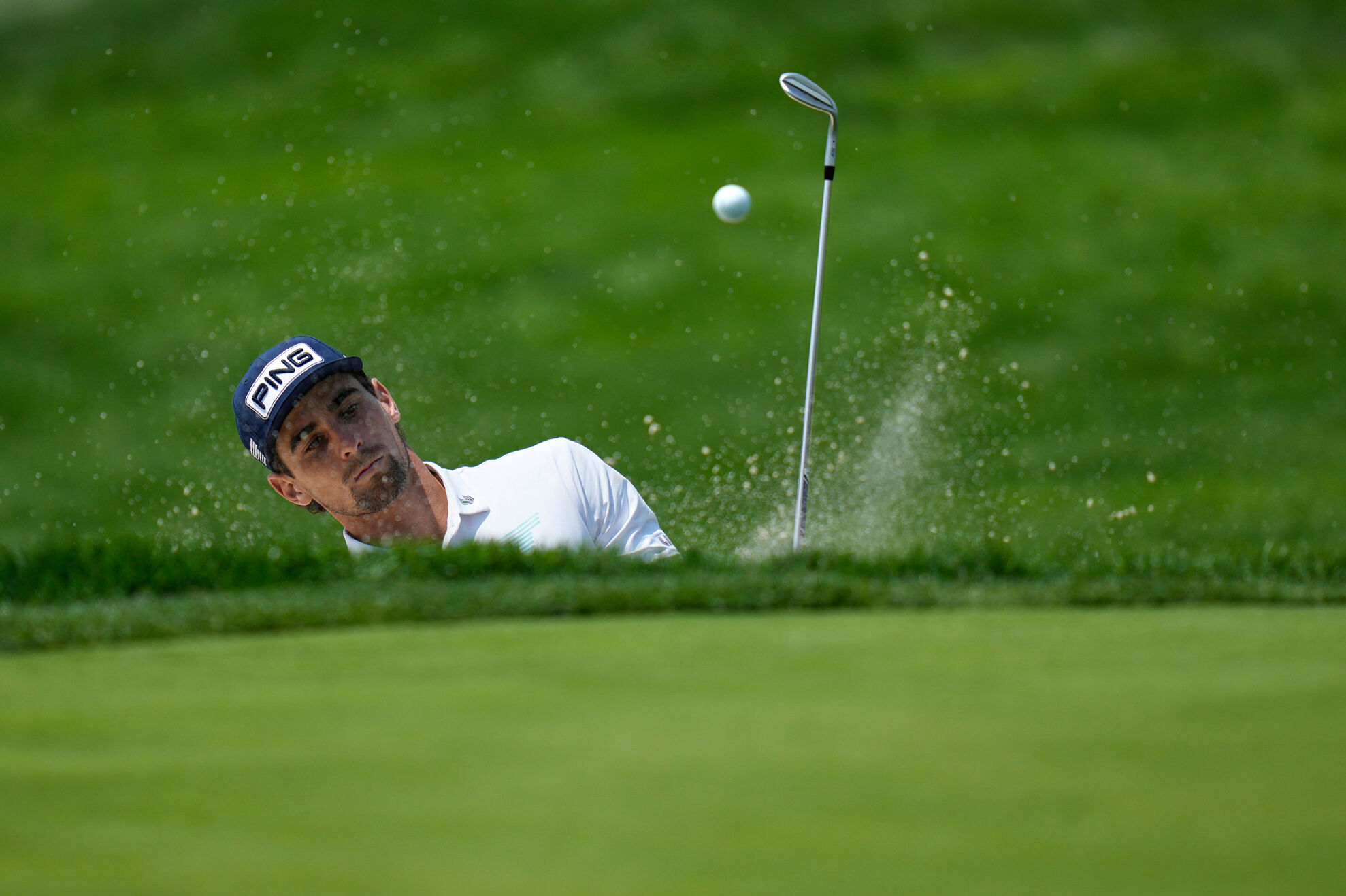 Joaquin Niemann, of Chile, chips onto the fifth green during a practice round ahead of the U.S. Open golf tournament at Oakmont Country Club Tuesday, June 10, 2025, in Oakmont, Pa.