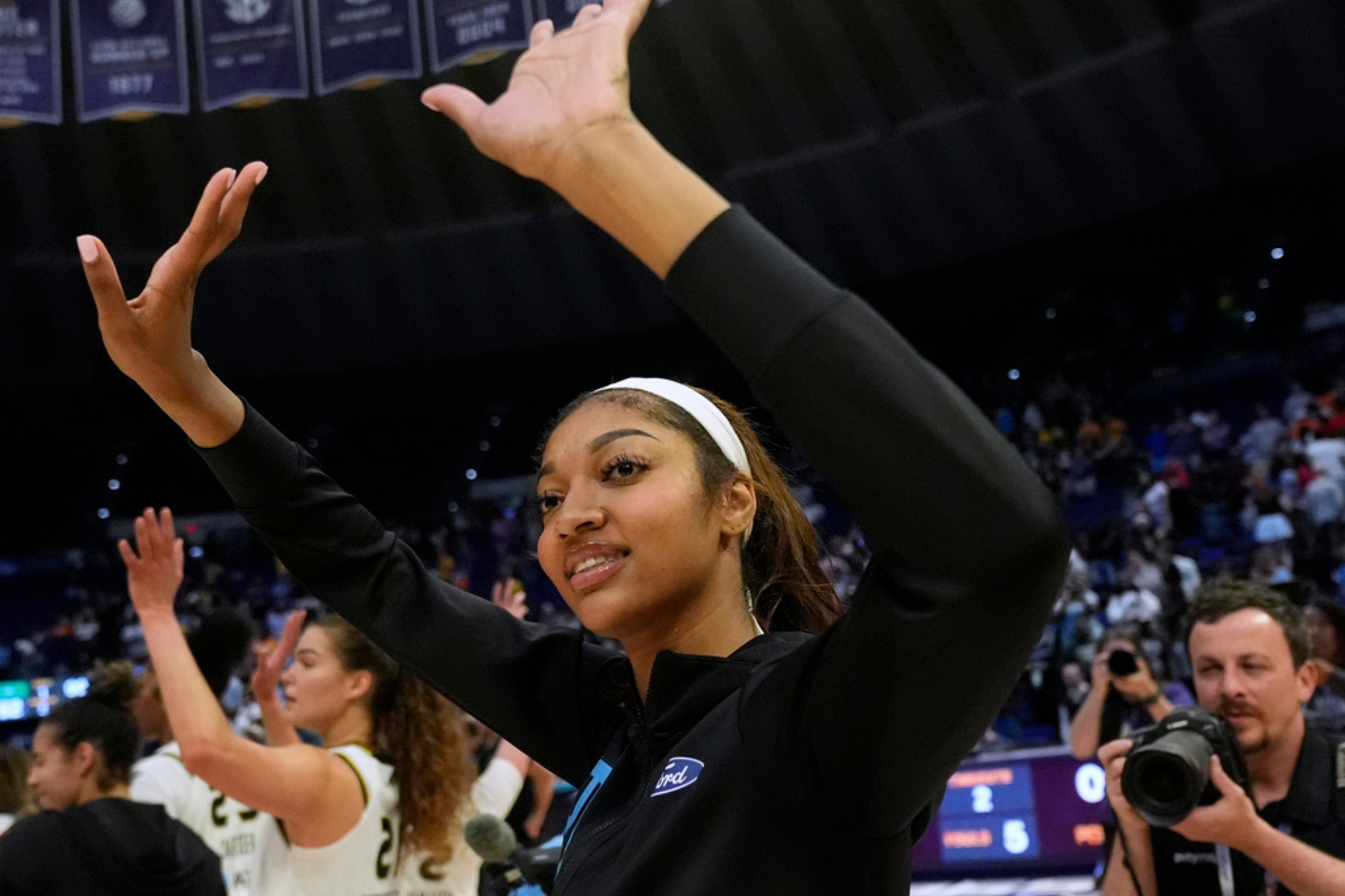 Chicago Sky forward Angel Reese responds to the crowd after a WNBA exhibition basketball game