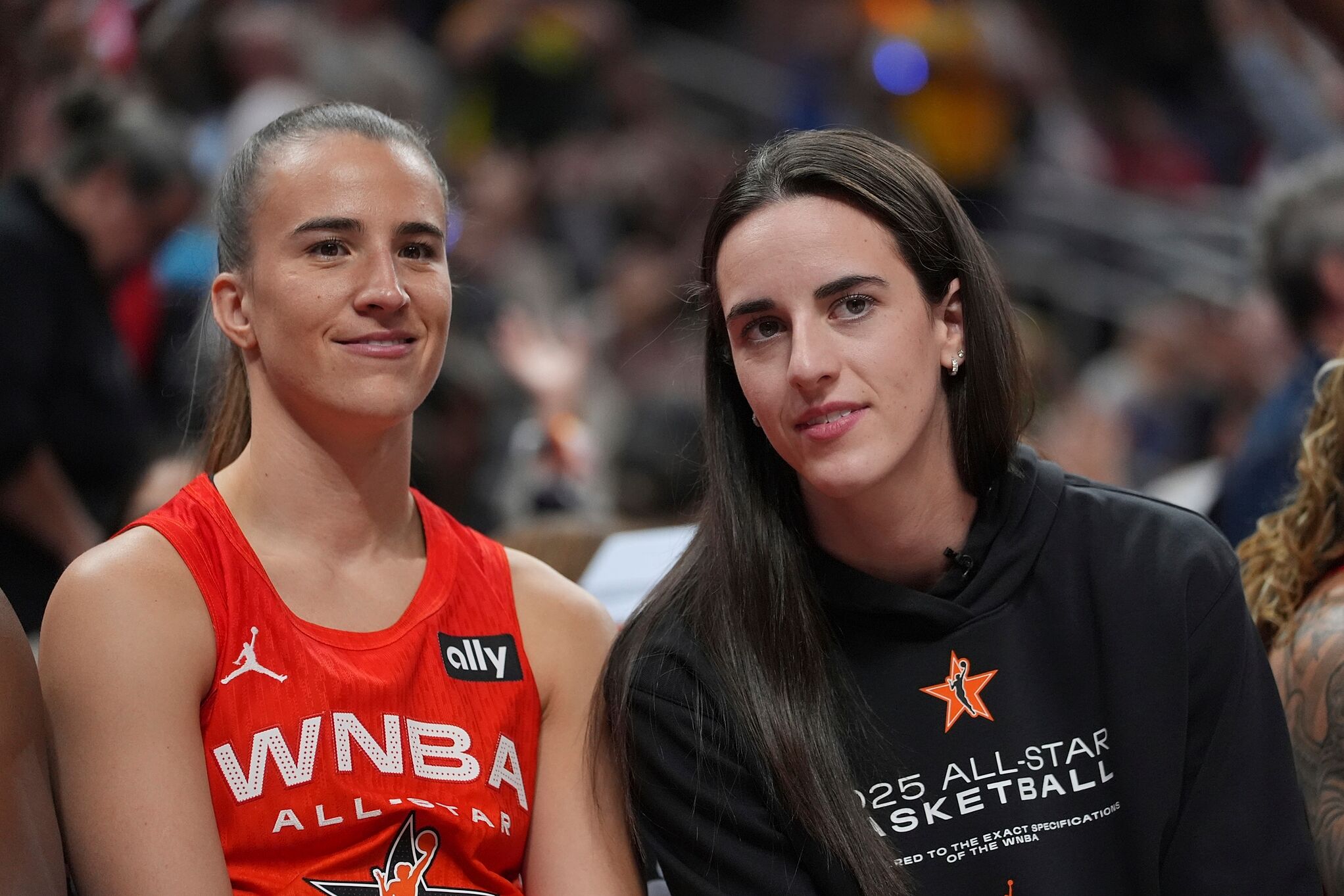 New York Liberty's Sabrina Ionescu, left, talks with Indiana Fever's Caitlin Clark during the WNBA All-Star basketball game