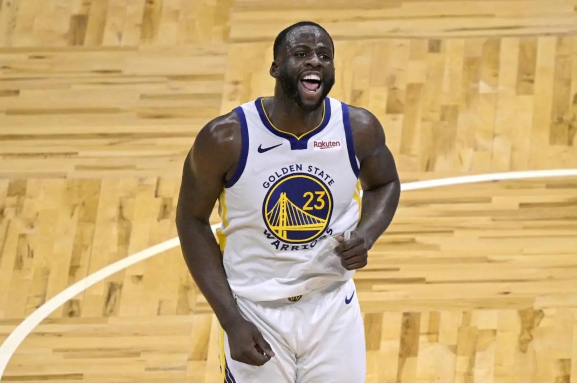 Draymond Green celebrates a three-pointer with the Warriors.