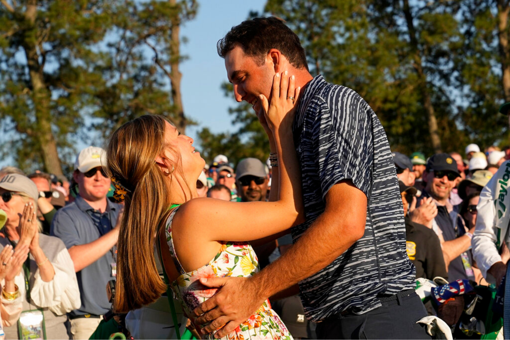 Scottie Scheffler hugs his wife Meredith Scudder after winning the 86th Masters golf tournament