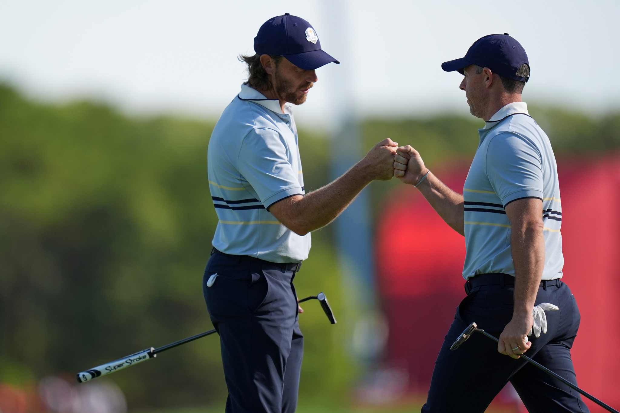 Europe's Tommy Fleetwood celebrates with Rory McIlroy on the 12th hole at Bethpage Black golf course during the lt;HIT gt;Ryder lt;/HIT gt; lt;HIT gt;Cup lt;/HIT gt; golf tournament, Friday, Sept. 26, 2025, in Farmingdale, N.Y. (AP Photo/Seth Wenig)