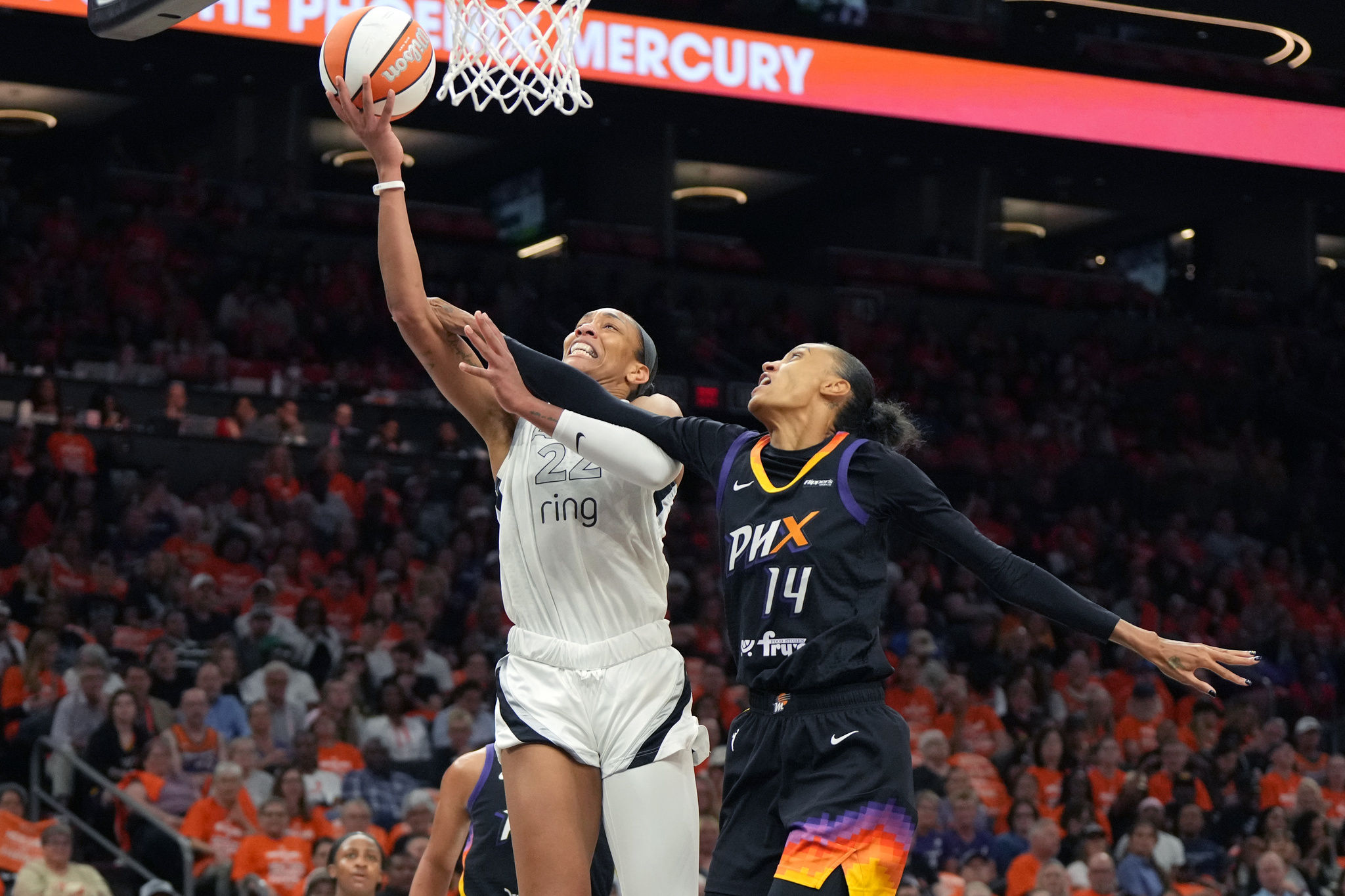 Las Vegas Aces center A'ja Wilson (22) gets fouled by Phoenix Mercury forward DeWanna Bonner
