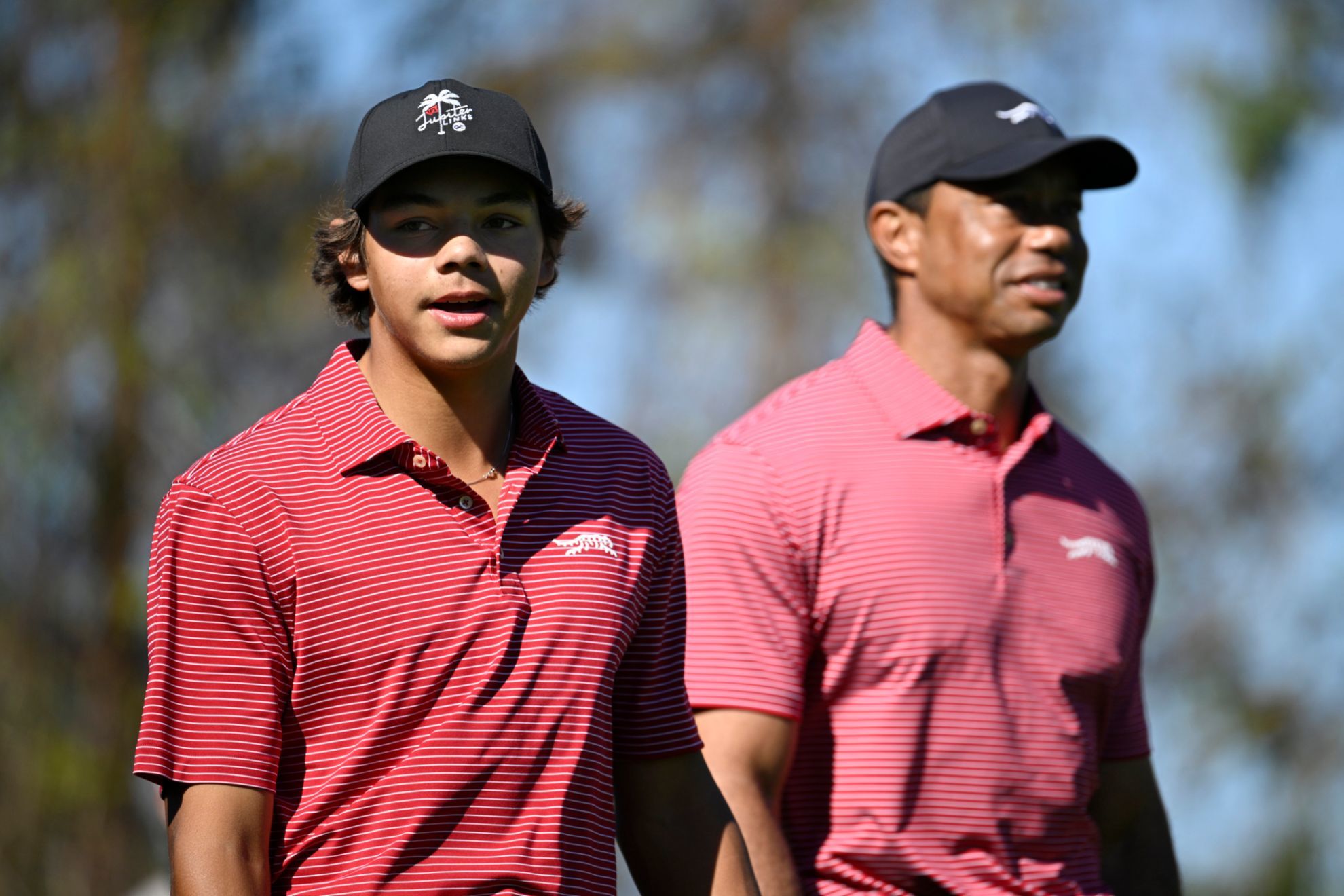 Charlie (left) and Tiger Woods (right)
