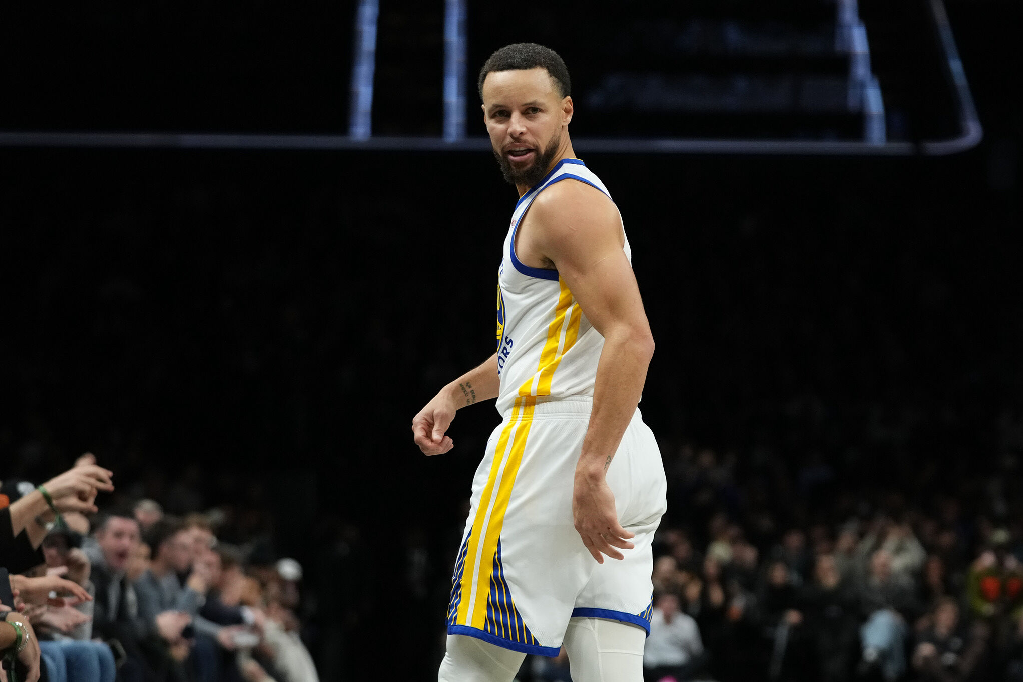 Golden State Warriors' Stephen Curry (30) reacts after scoring during an NBA basketball game against the Brooklyn Nets