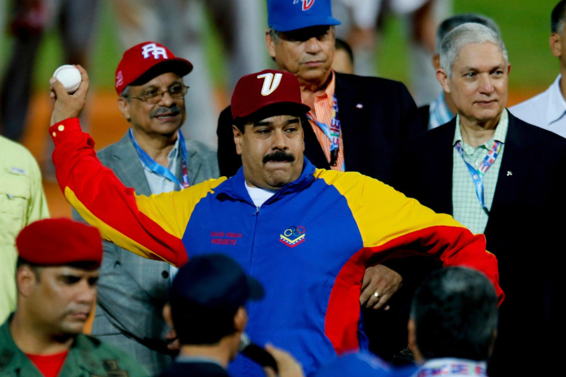 Venezuela's President Nicolas Maduro winds up to pitch a ball during the opening ceremony of the Caribbean Series