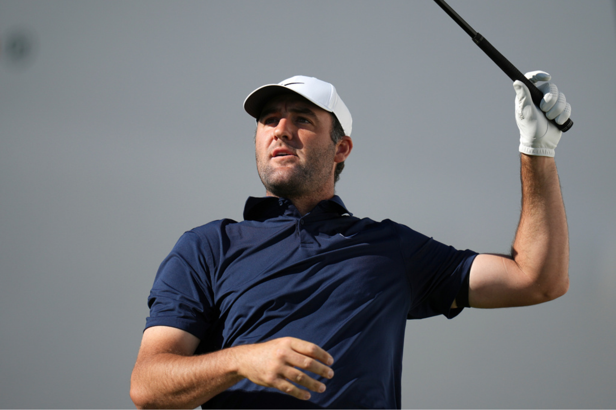 Scottie Scheffler watches his tee shot at the 17th hole during the first round of the Phoenix Open