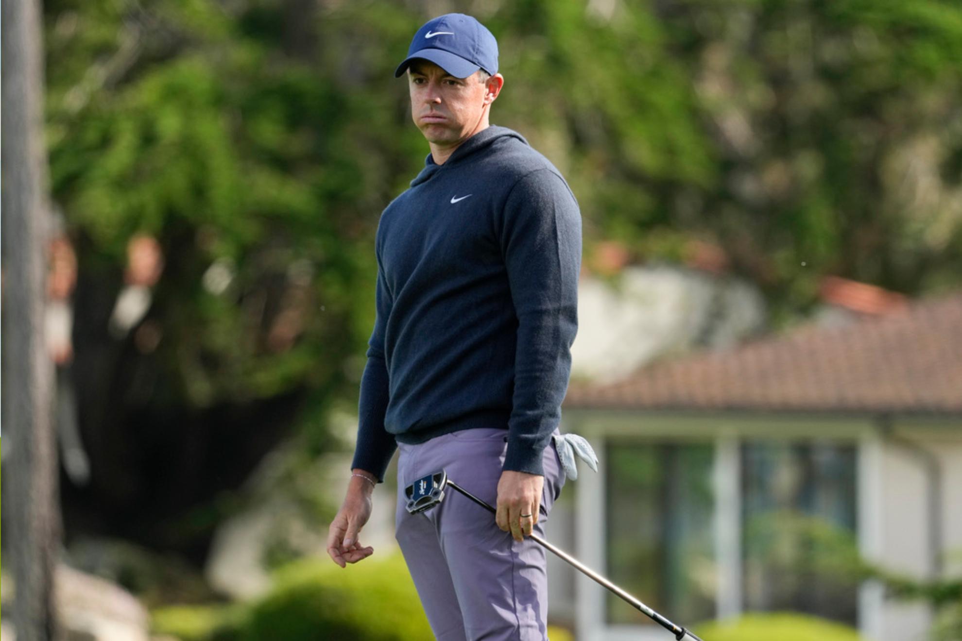 Rory Mcllroy reacts after a missed putt on the 18th green