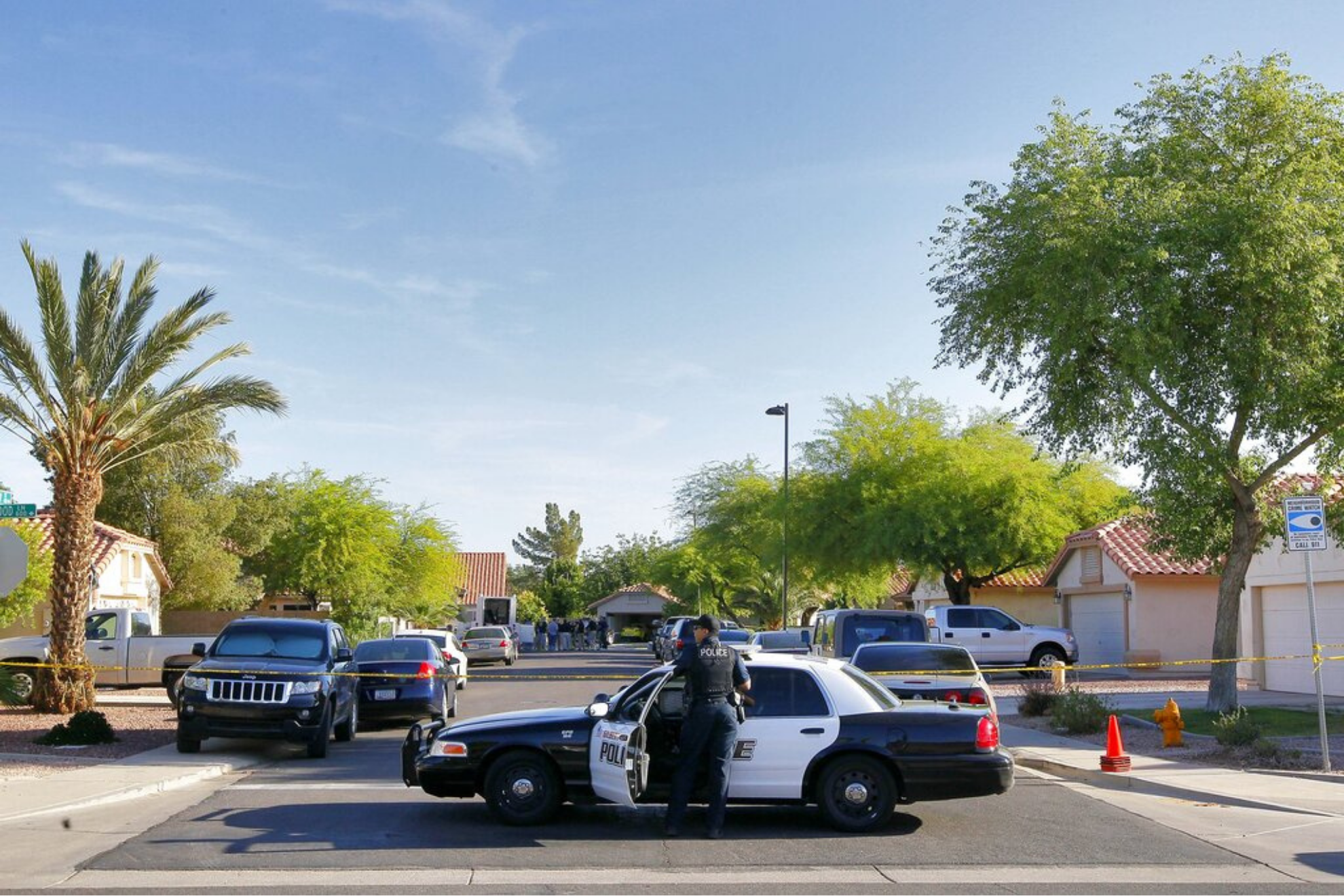 A Gilbert police officer blocks the street