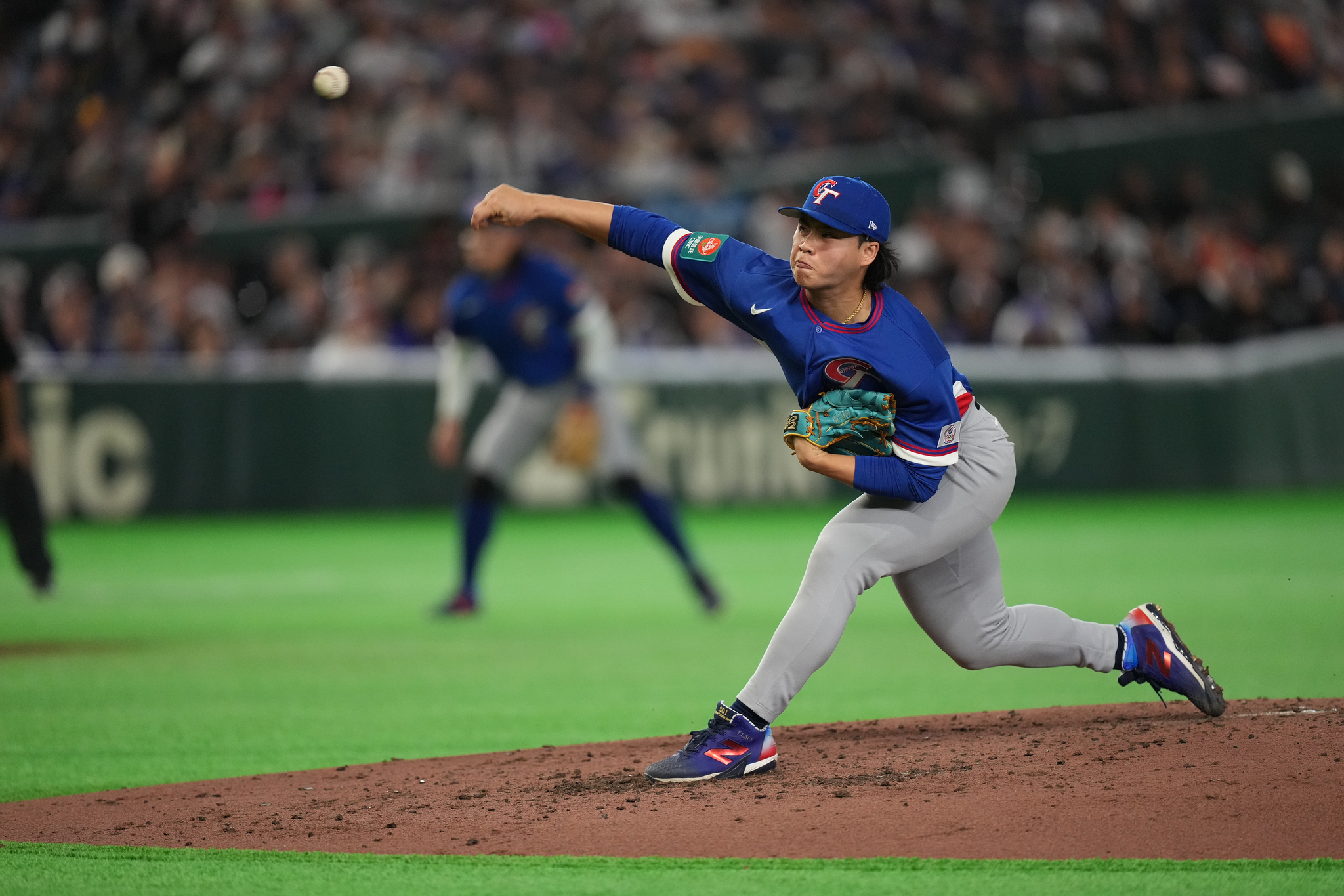 Taiwan's pitcher Sun Yi-lei throws the ball against Australia in the sixth inning