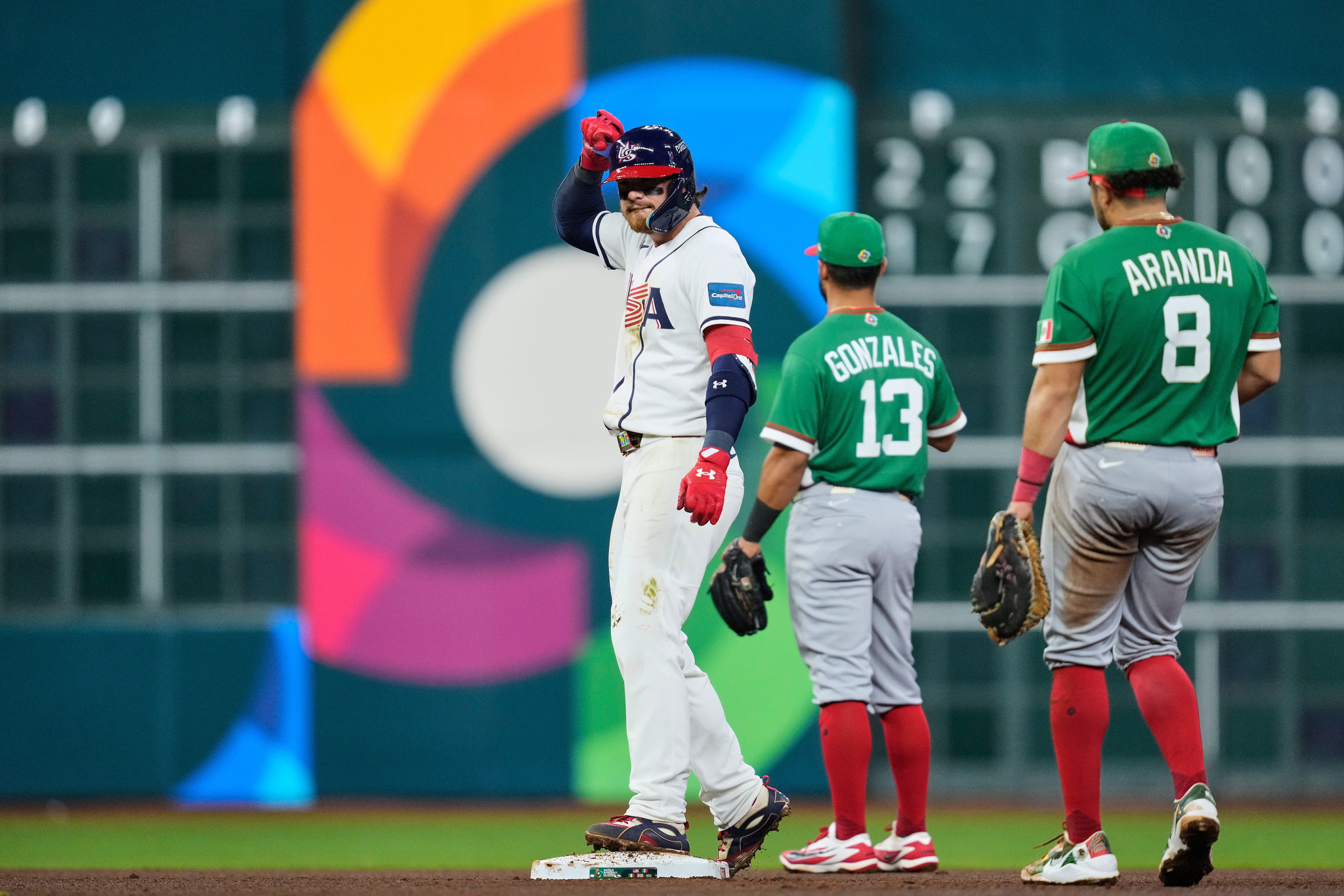 United States' Bobby Witt Jr., left, reacts after hitting a double during the fourth inning of a lt;HIT gt;World lt;/HIT gt; lt;HIT gt;Baseball lt;/HIT gt; lt;HIT gt;Classic lt;/HIT gt; game against lt;HIT gt;Mexico lt;/HIT gt;, Monday, March 9, 2026, in Houston. (AP Photo/Ashley Landis)