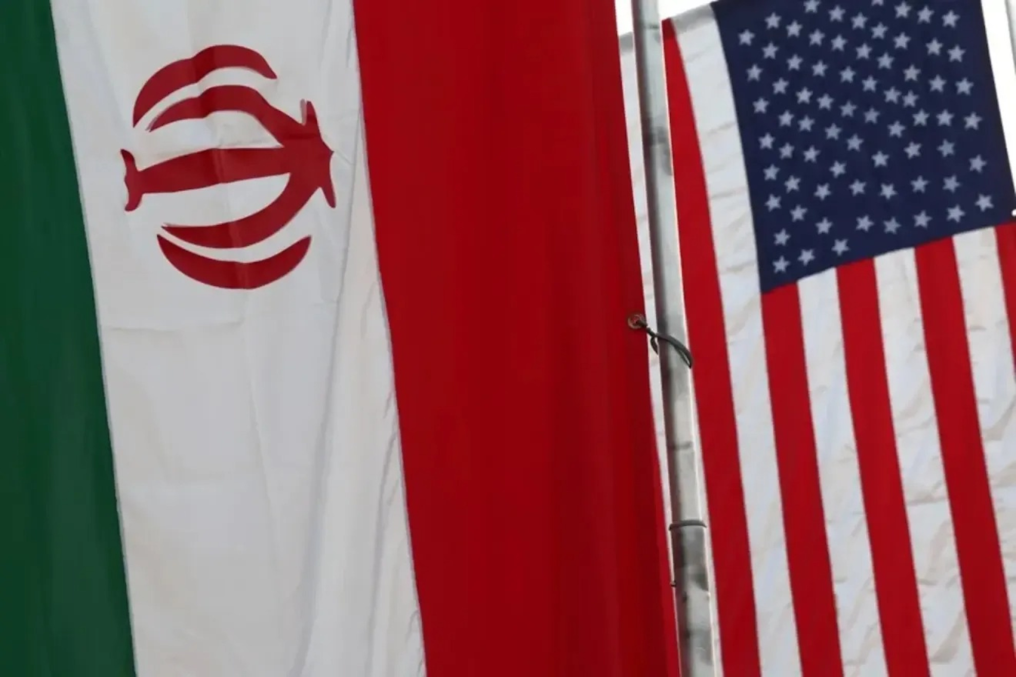 Flags of the United States and Iran.