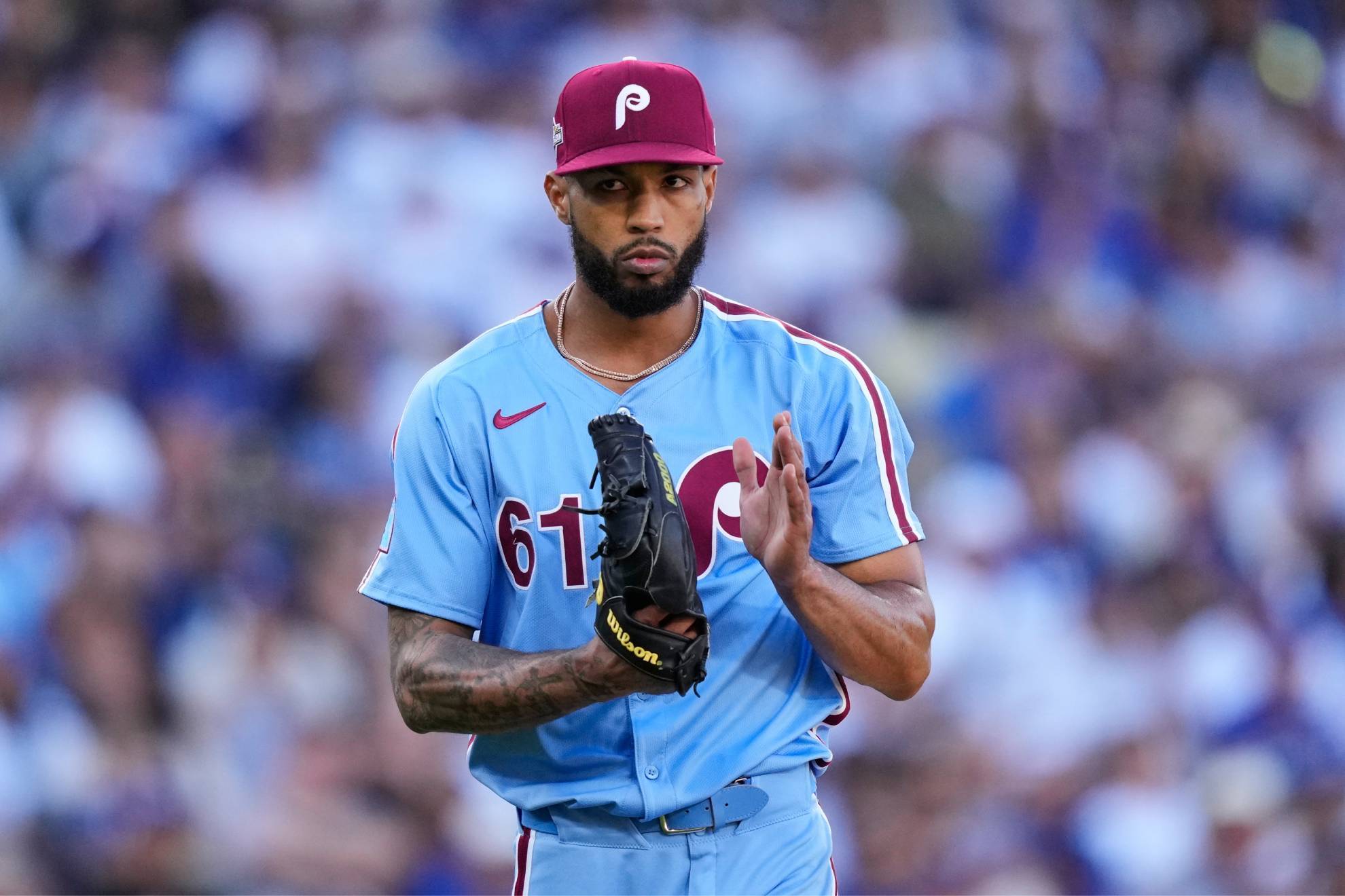 Cristopher Sanchez claps as he walks off the field after a ground out by Los Angeles Dodgers' Andy Pages /