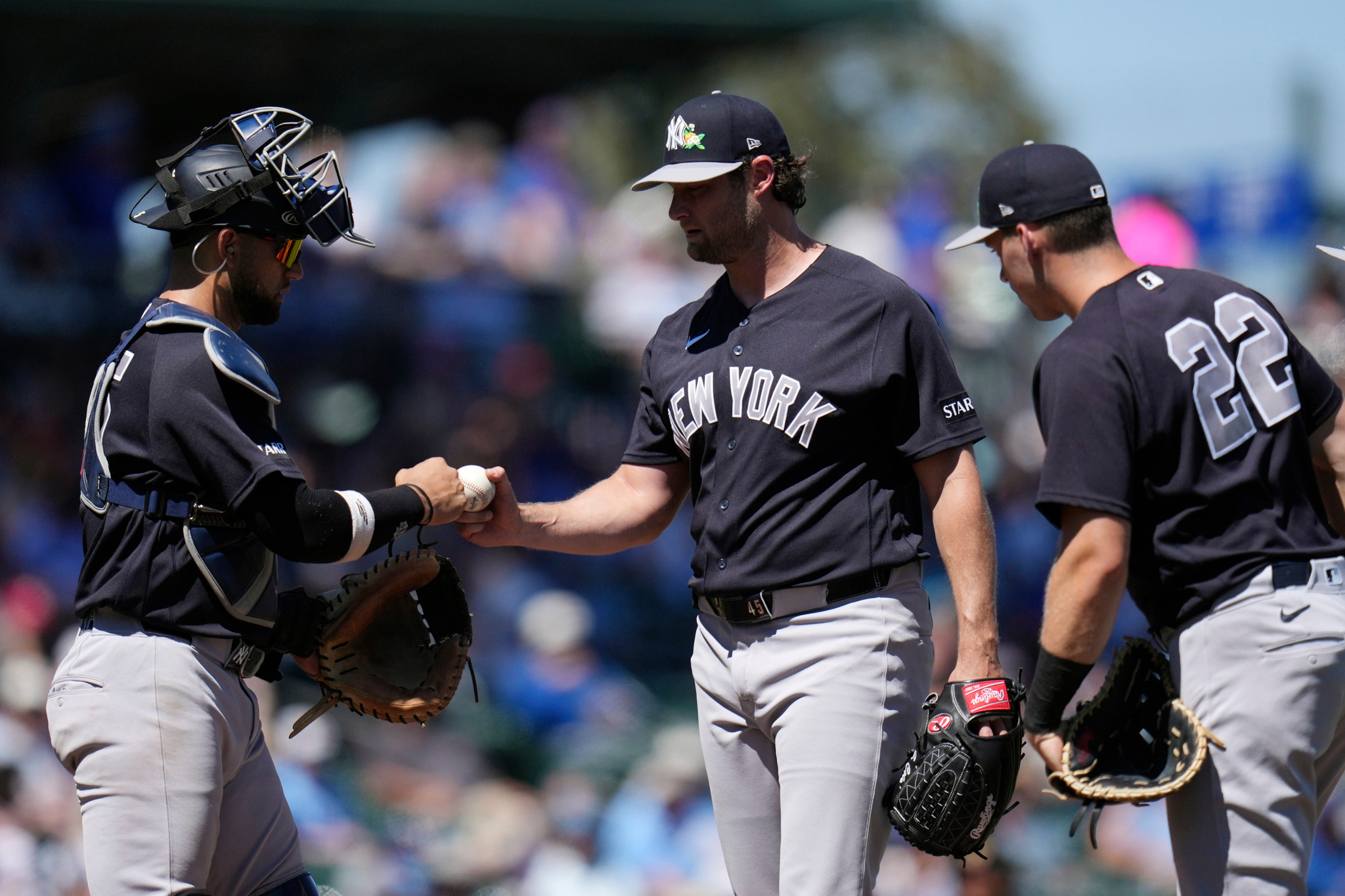 New York Yankees starting pitcher Gerrit Cole, center, gets a fist bump catcher J.C. Escarra