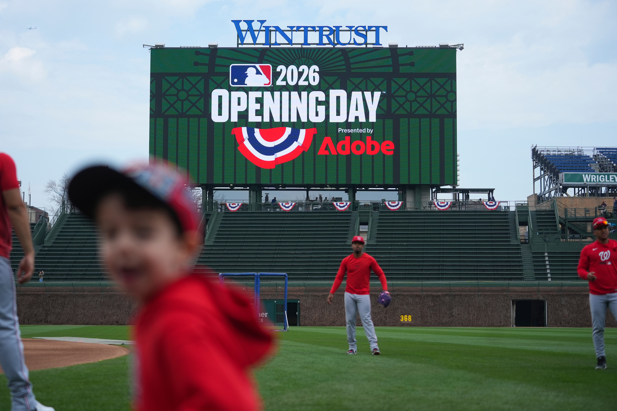 The Washington Nationals warm up before ano pening-day baseball game against the Chicago Cubs,