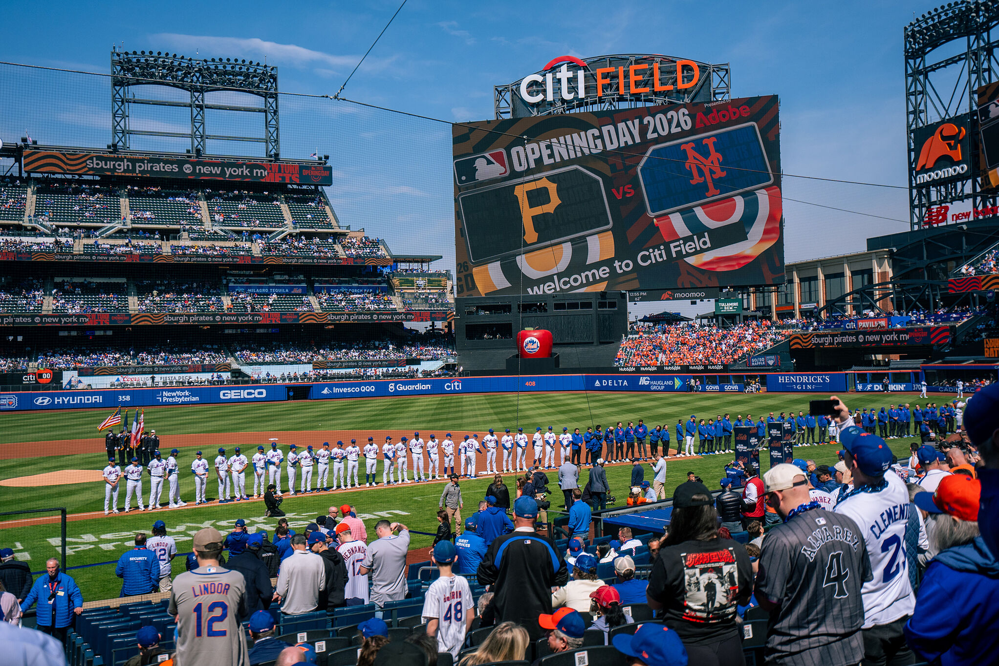 Players line up for introductions during an opening-day baseball game between the New York Mets and the Pittsburgh Pirates