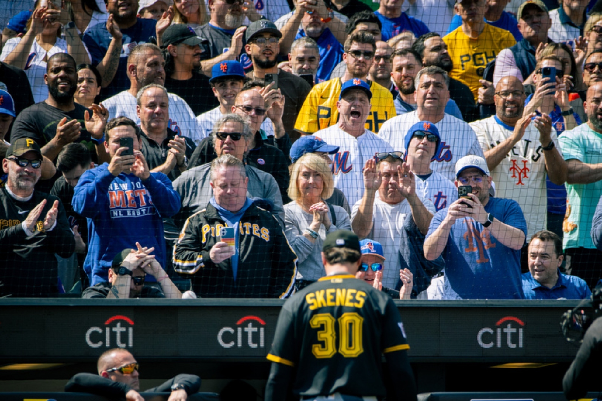 The crowd cheers and jeers as Pittsburgh Pirates pitcher Paul Skenes.
