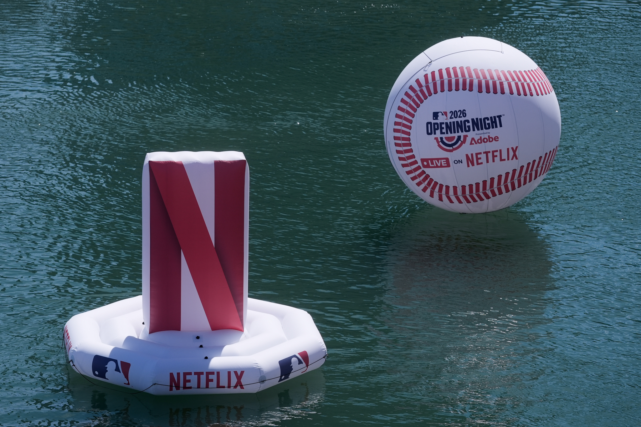 A lt;HIT gt;Netflix lt;/HIT gt; logo and baseball are shown in McCovey Cove before a baseball game between the San Francisco Giants and the New York Yankees in San Francisco, Wednesday, March 25, 2026. (AP Photo/Jeff Chiu)